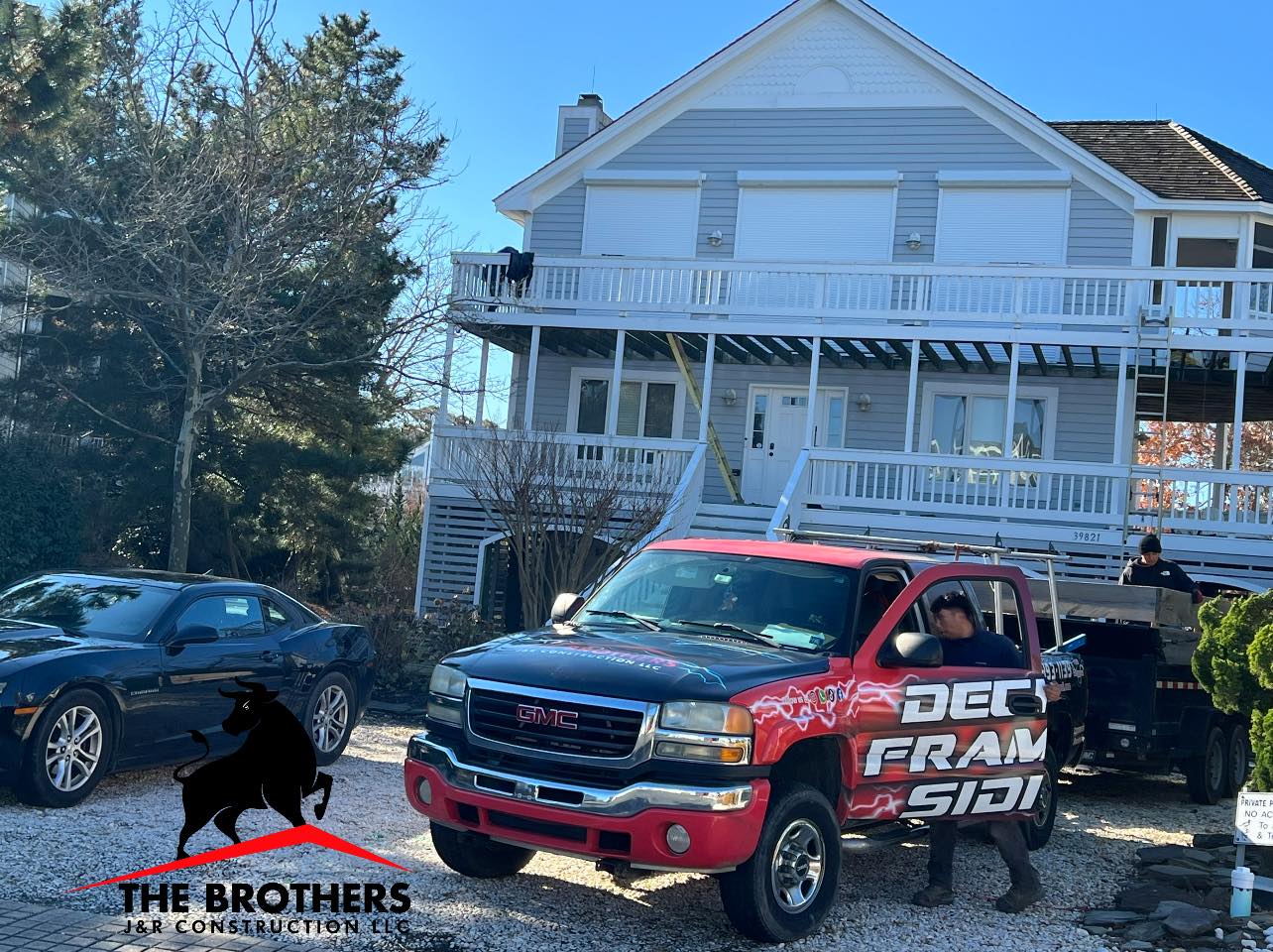 Construction crew with company truck at residential project site in Lewes Delaware