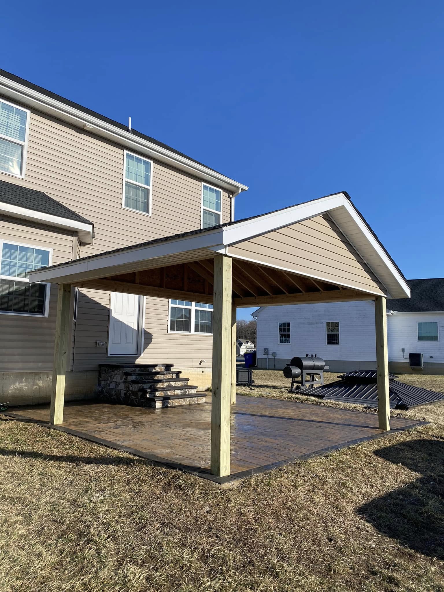 Covered porch installation on residential home in Lewes DE construction project