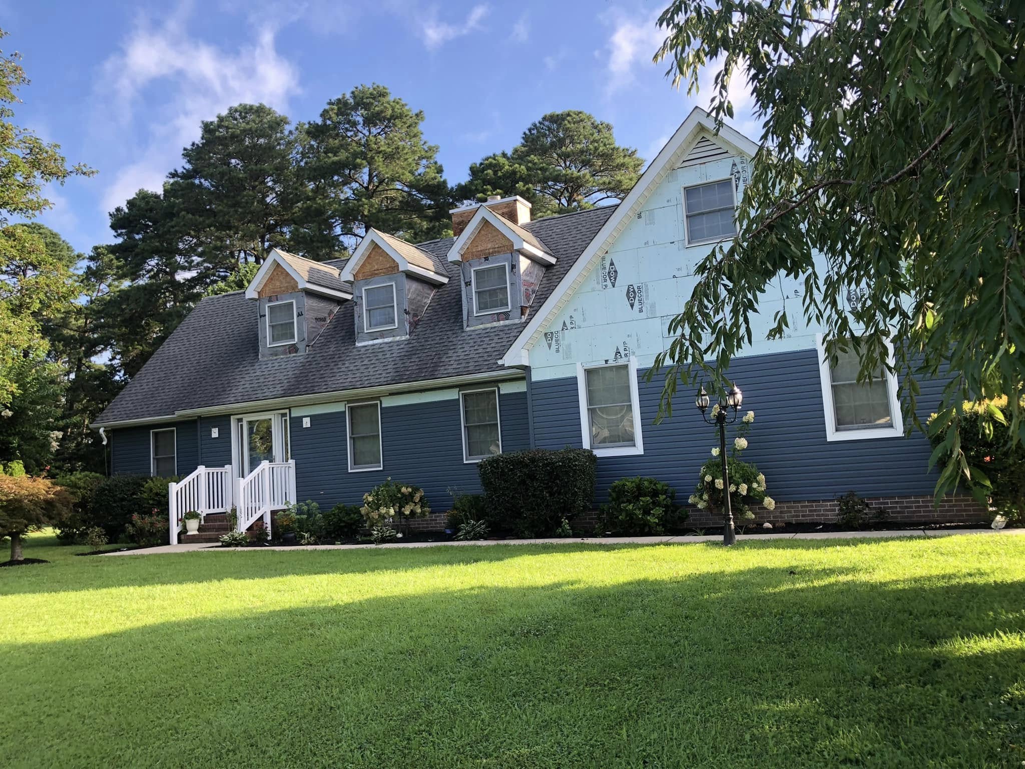 Finished residential home exterior with siding and landscaping in Lewes Delaware