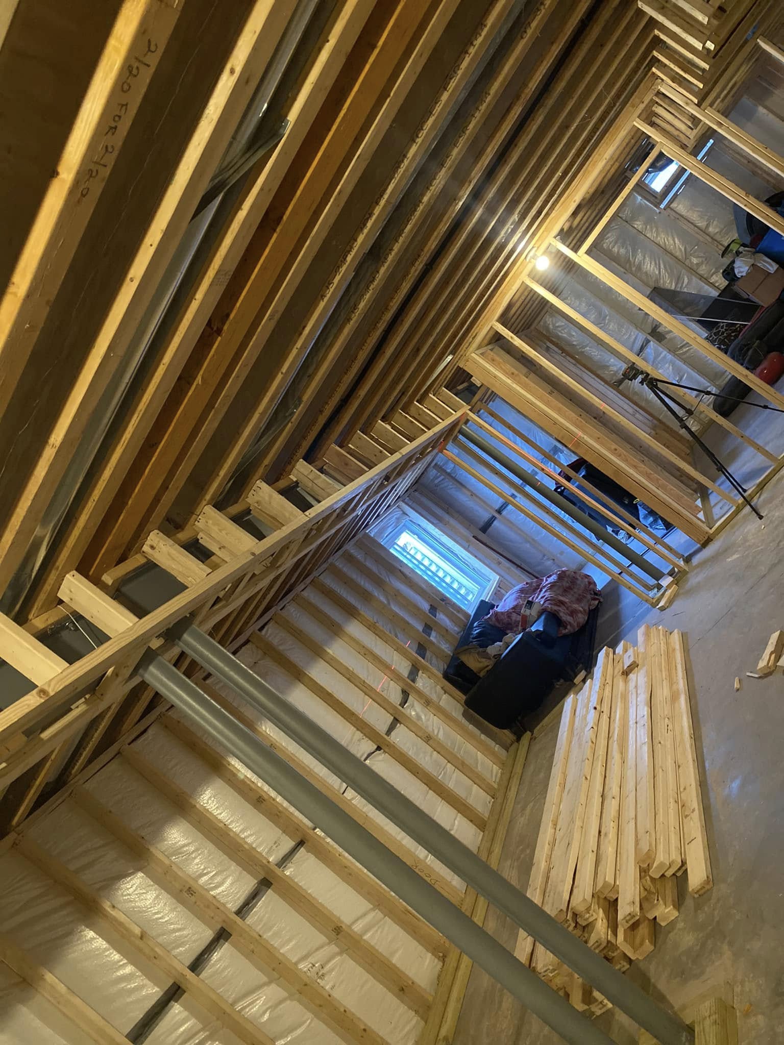 Interior wood framing structure under construction inside residential home in Lewes DE