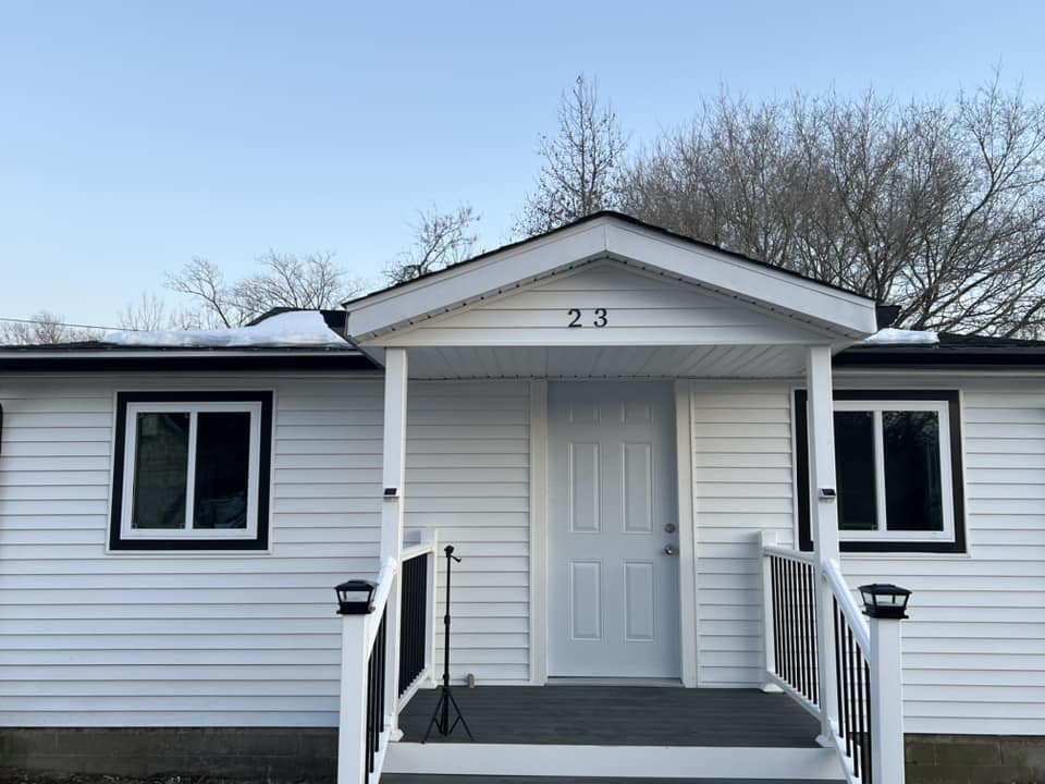 Small house exterior renovation with new siding and front entry in Lewes Delaware