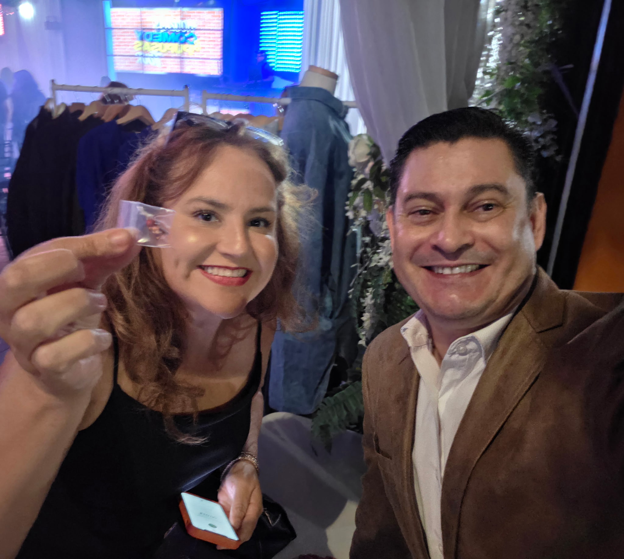 a microphone in front of a rainbow colored curtain