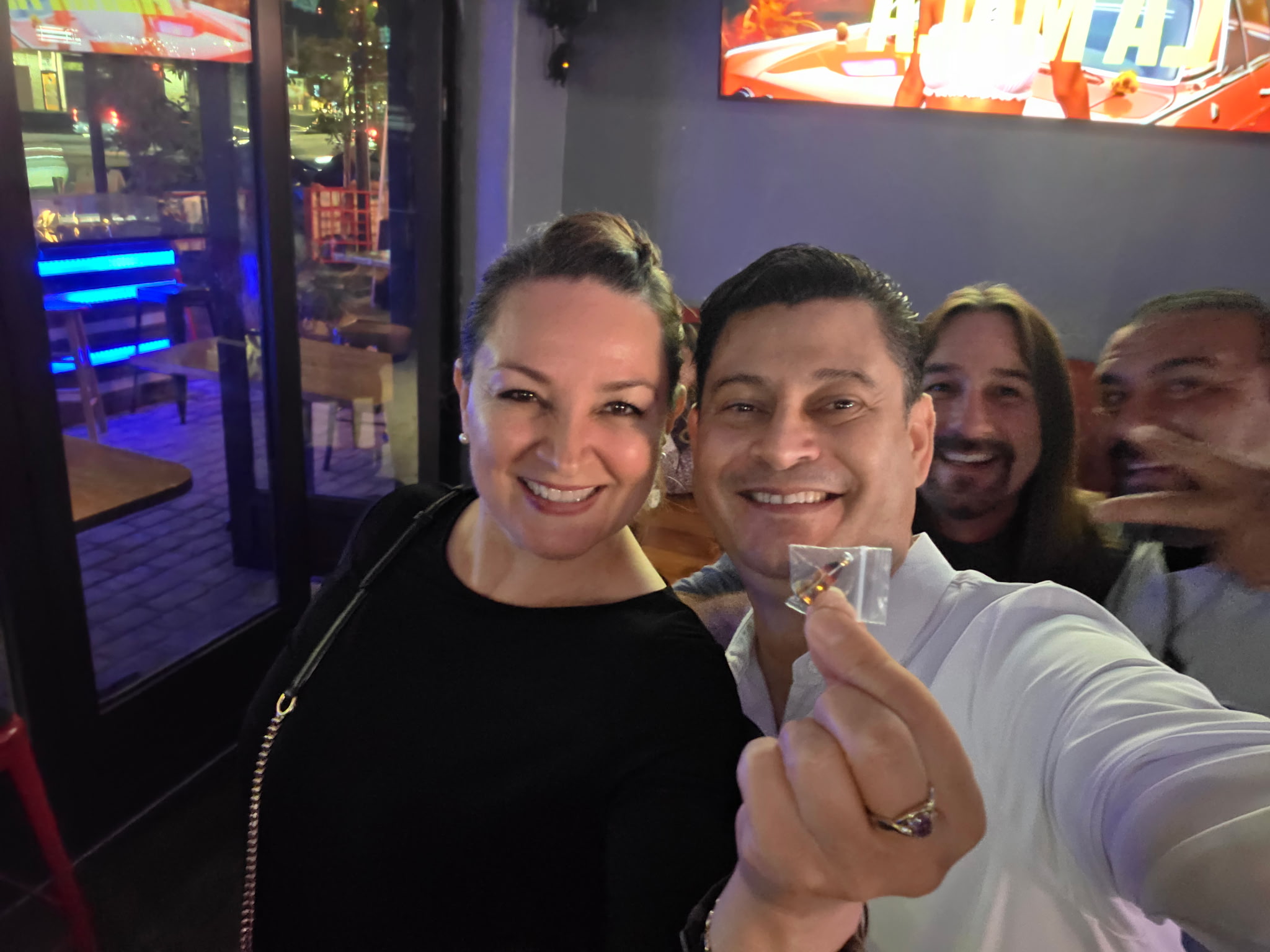 Young woman with headphones talking outdoors