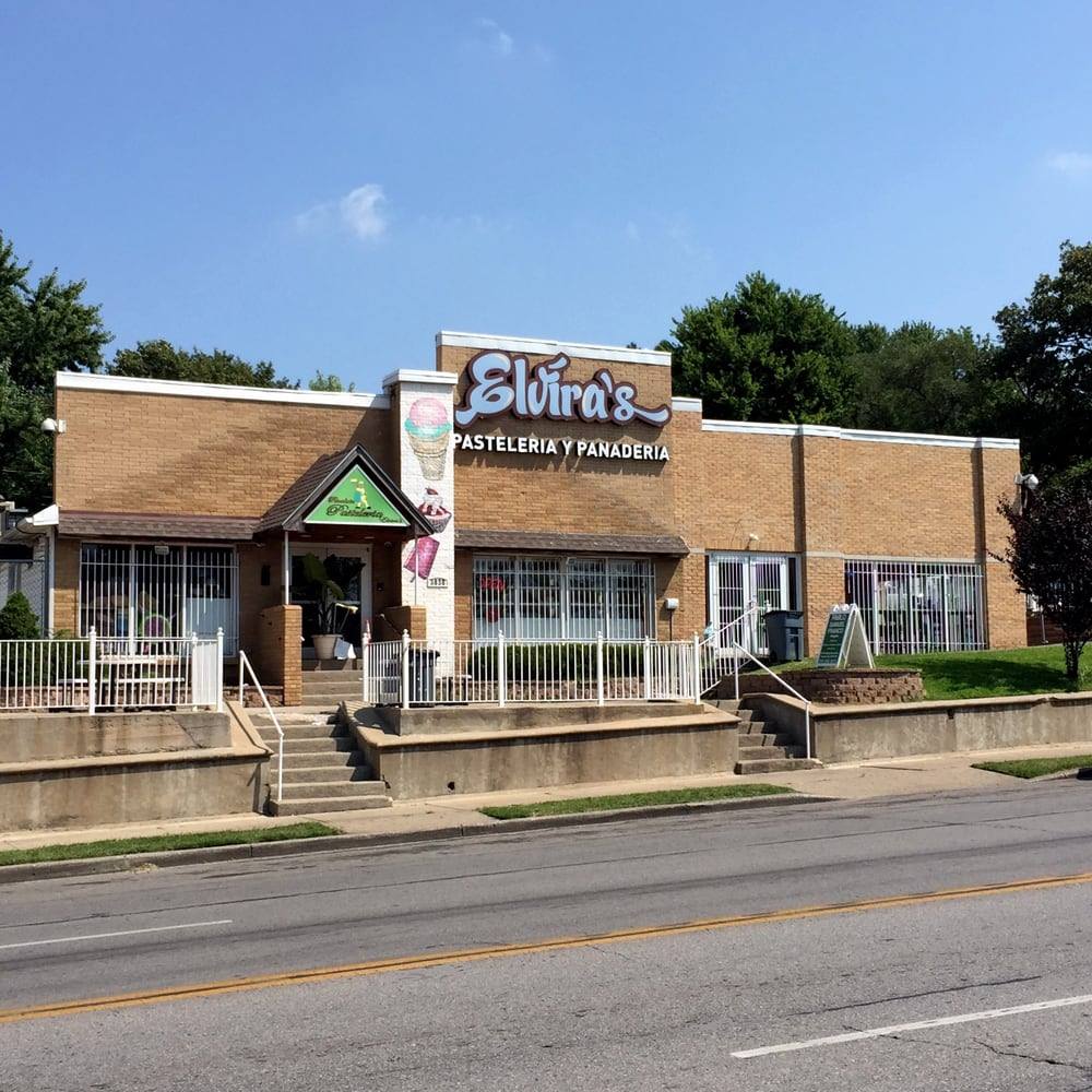 Sol y Masa storefront with bright signage and sidewalk seating in natural daylight.