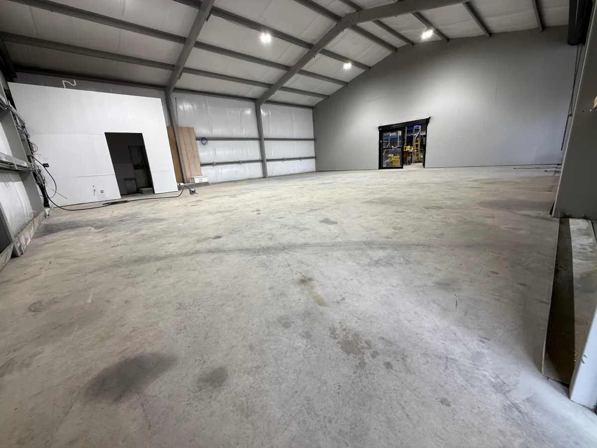 a man using a grinder on a piece of concrete