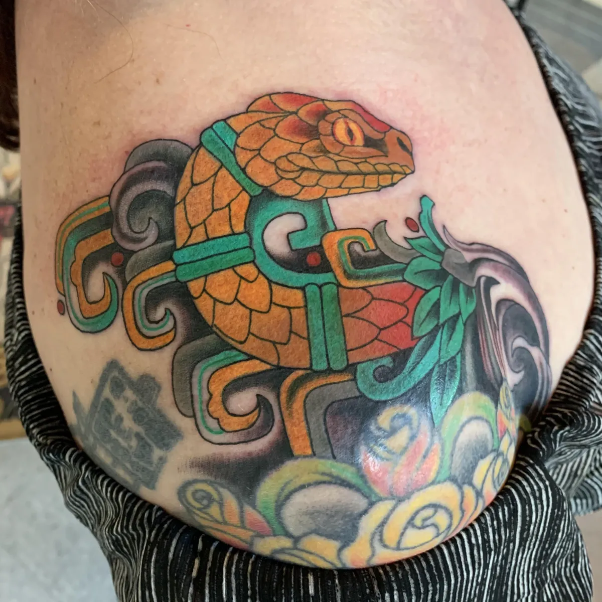 Dotwork cosmic mandala centered on upper back, radial precision and micro-dots create depth; moody studio lighting, high contrast black ink, square framing to showcase radial symmetry and healed tonal transitions.