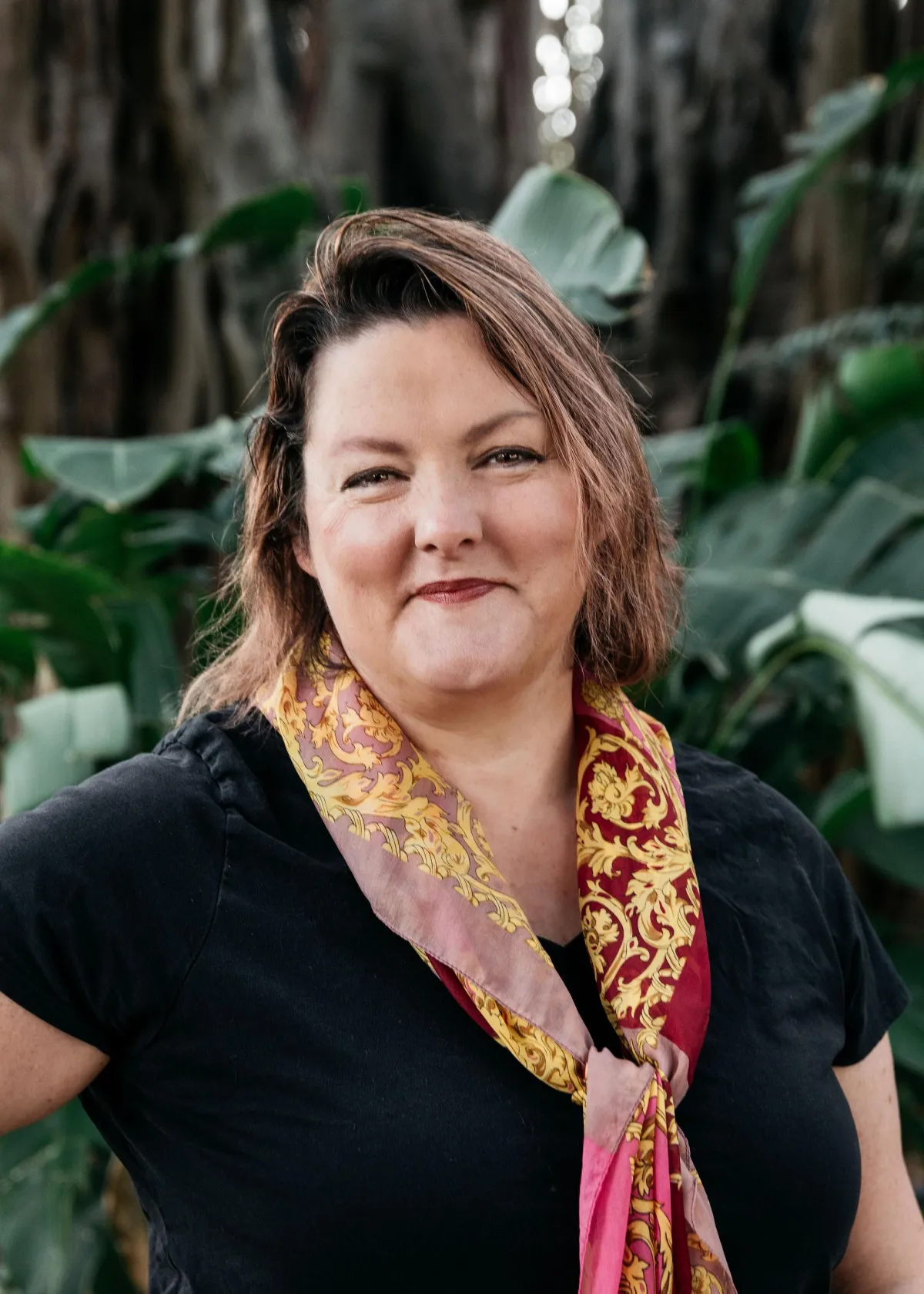 Cathie Wilson is your transformation catalyst. She also really likes trees (pictured here with her).