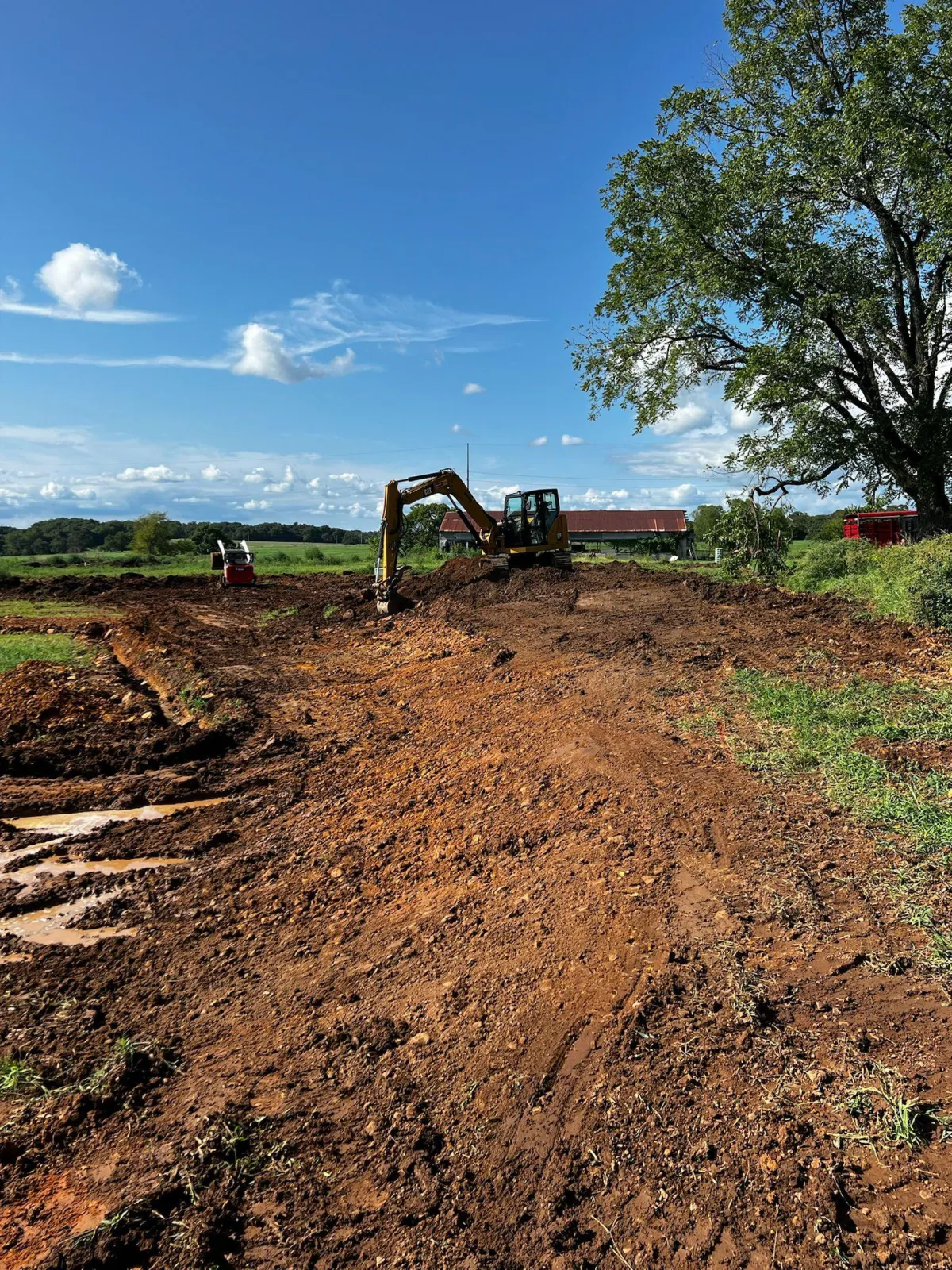 Professional dirt work and land grading in Springdale AR by TRS Concrete & Hardscapes LLC preparing site for concrete installation