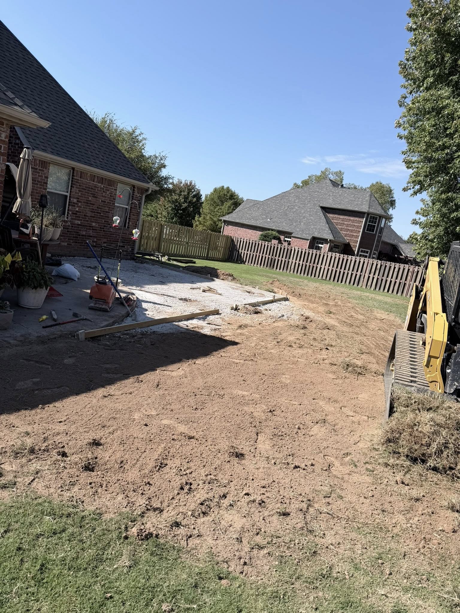 Excavation and site preparation for driveway and slab installation in Northwest Arkansas