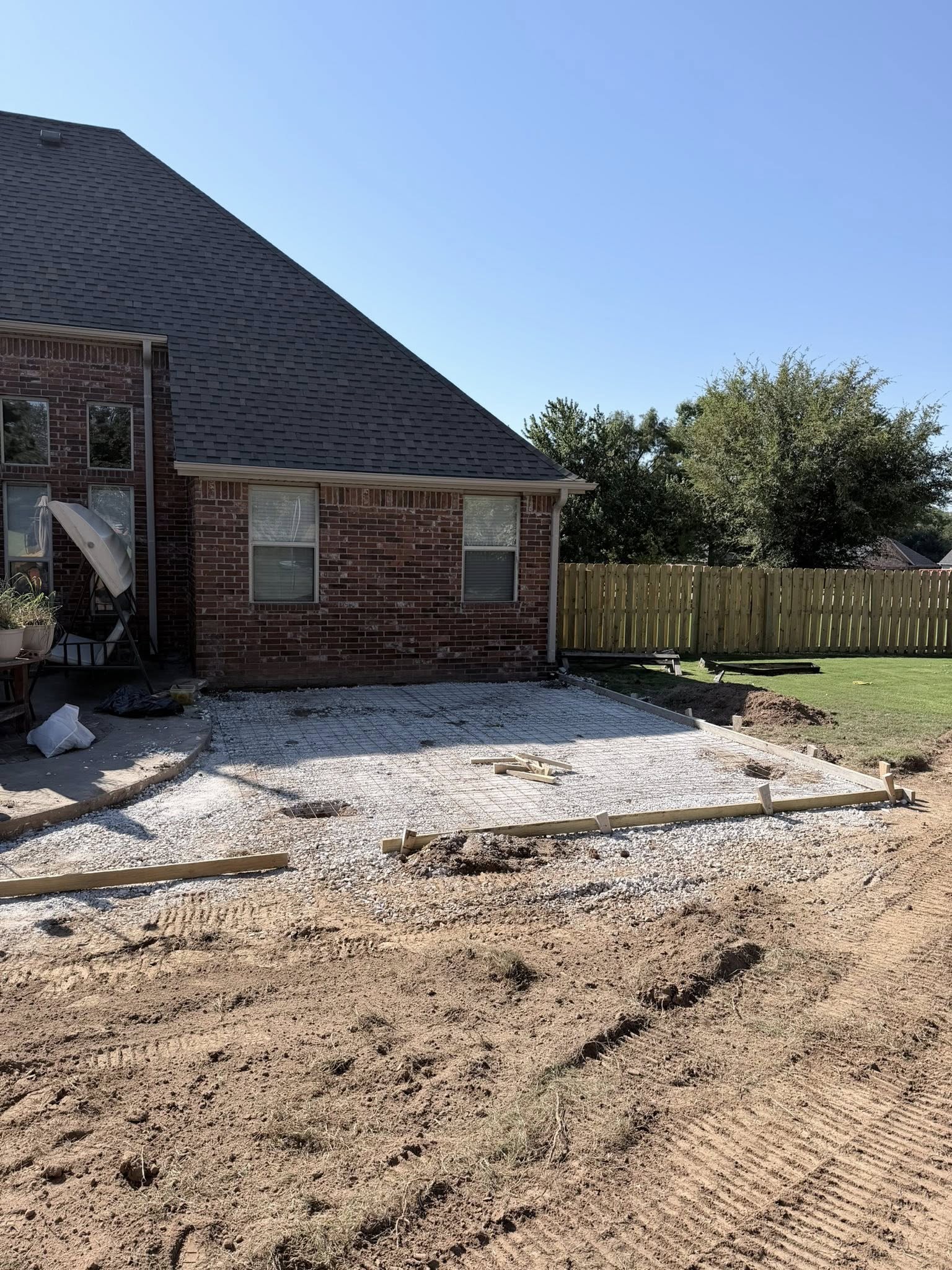 Backyard concrete patio extension installed in Springdale Arkansas