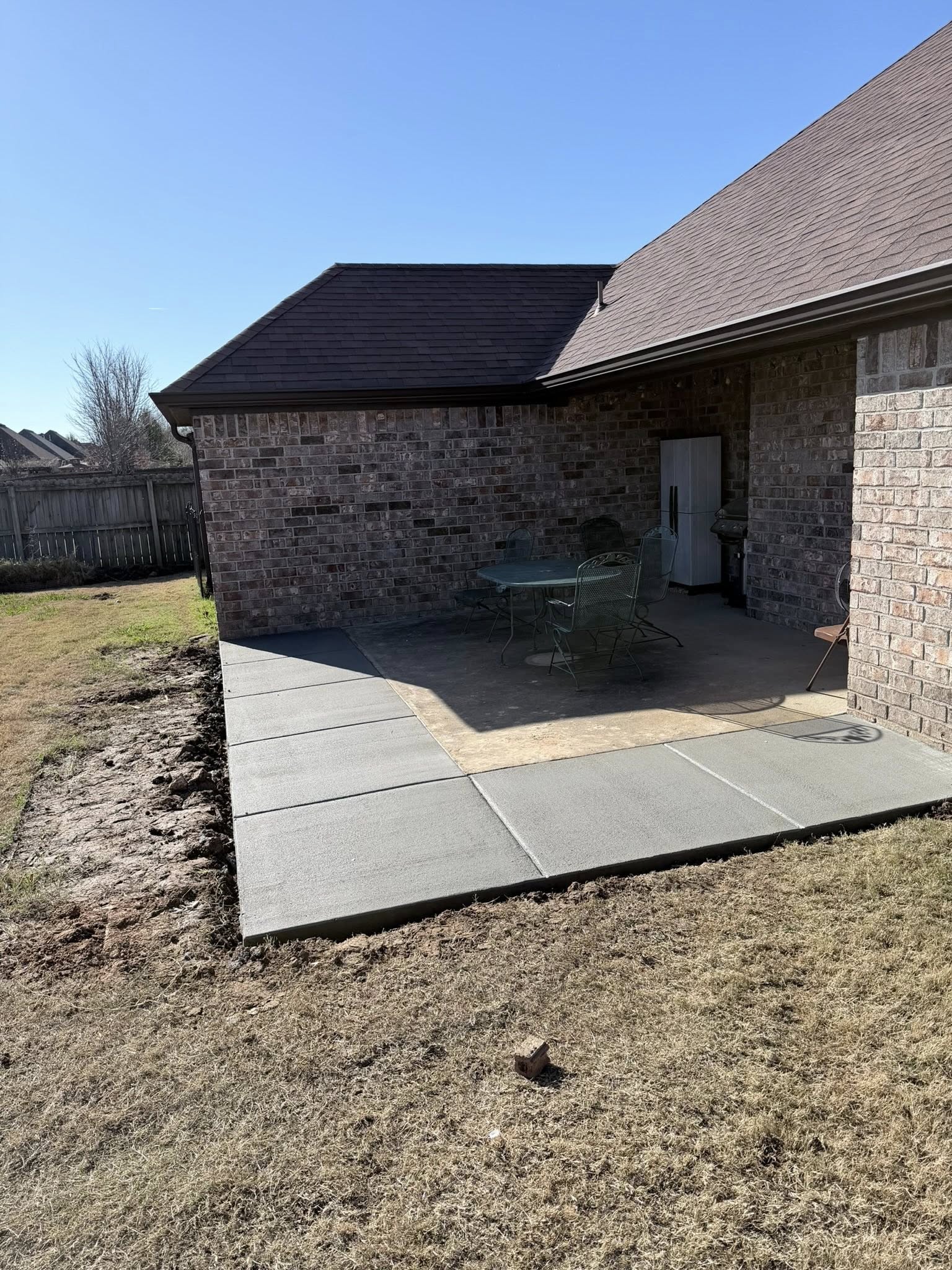 Concrete patio installation for backyard in Springdale AR by TRS Concrete & Hardscapes LLC