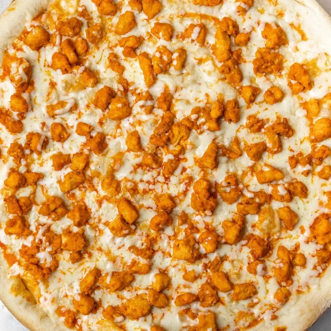 Buffalo-Chicken Pizza featuring buffalo-style chicken pieces.