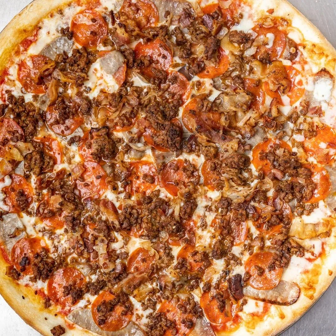 Farmers Pizza loaded with pepperoni, sausage, beef, and bacon.