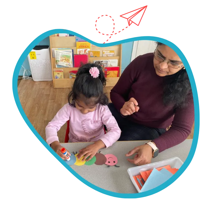 Keen Learners Montessori staff and child smiling in a Fremont Montessori classroom