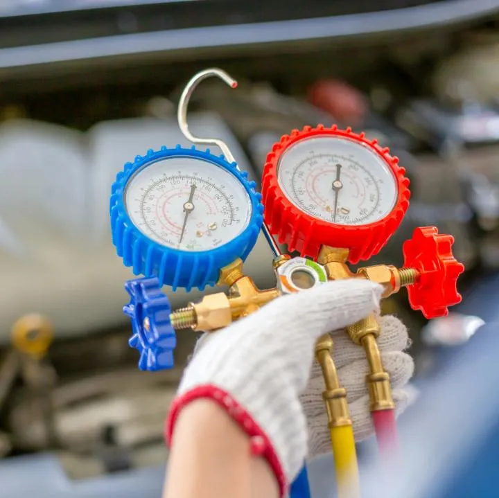 Technicians Checking Air Conditioner