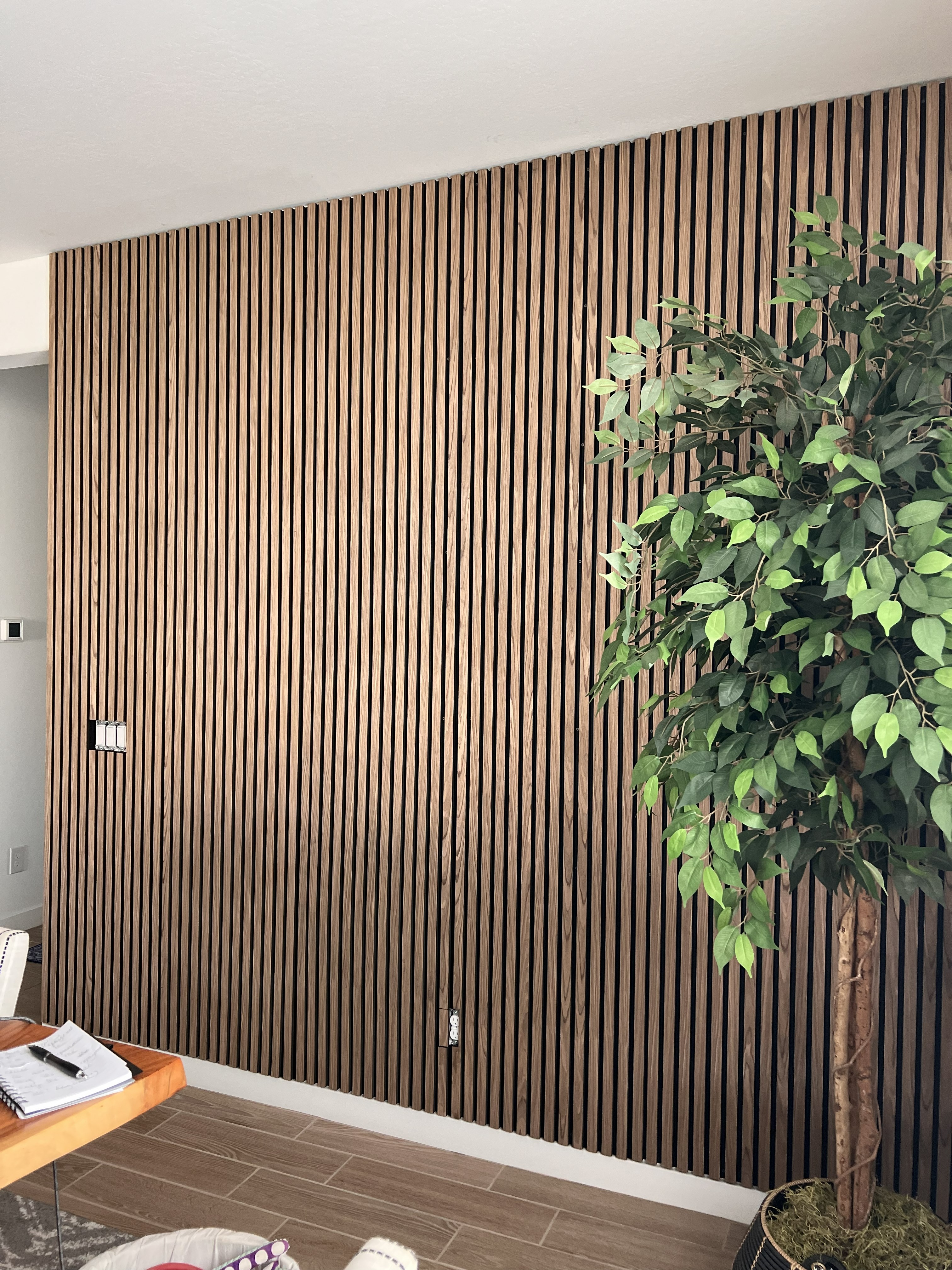 Wood slat accent wall panels in dining room installed by homeowner in Arizona retirement home