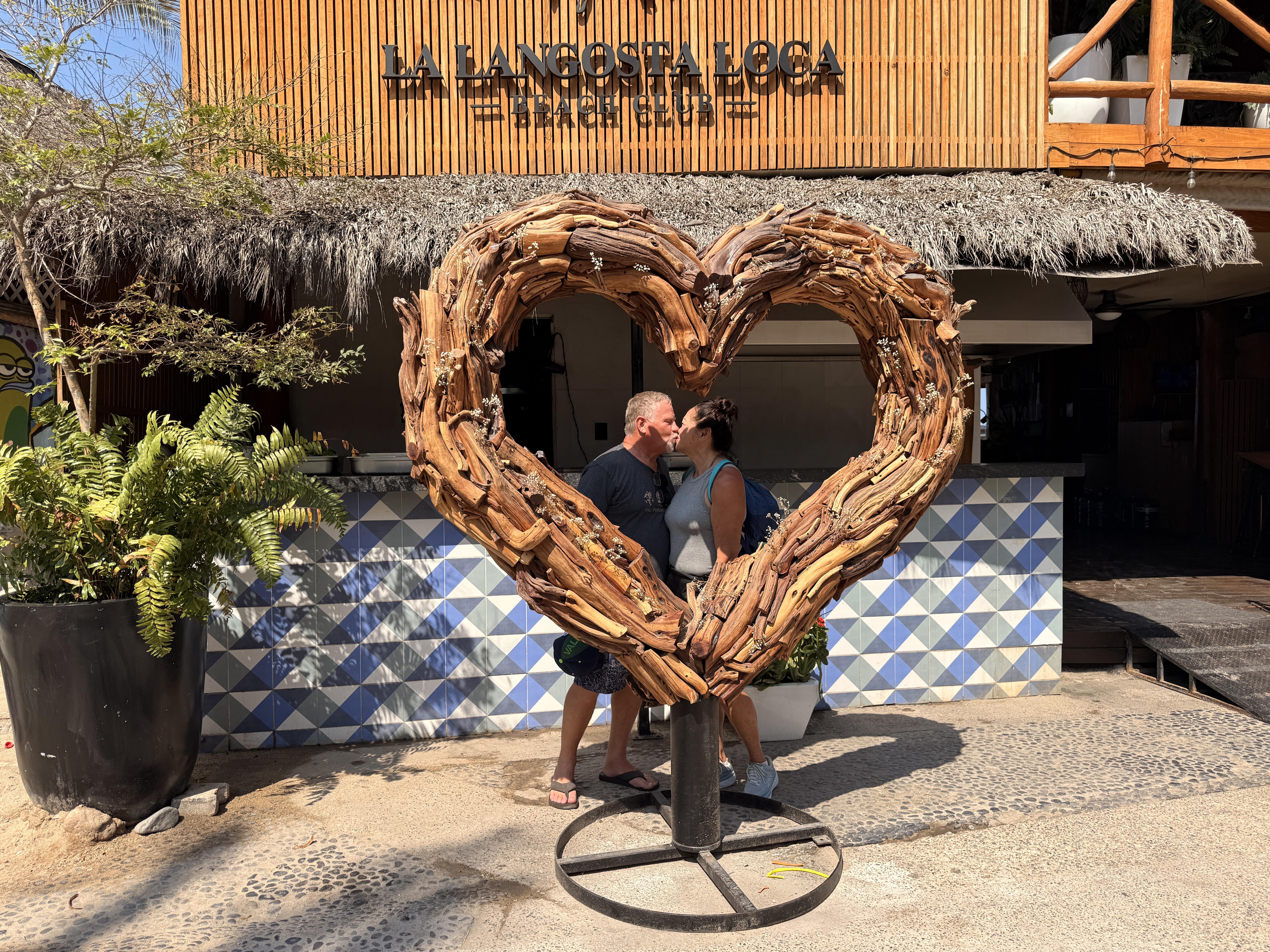 One of my favorite moments of the entire Puerto Vallarta day happened at La Langosta Loca Beach Club where there is the most gorgeous large driftwood heart sculpture outside the entrance. .