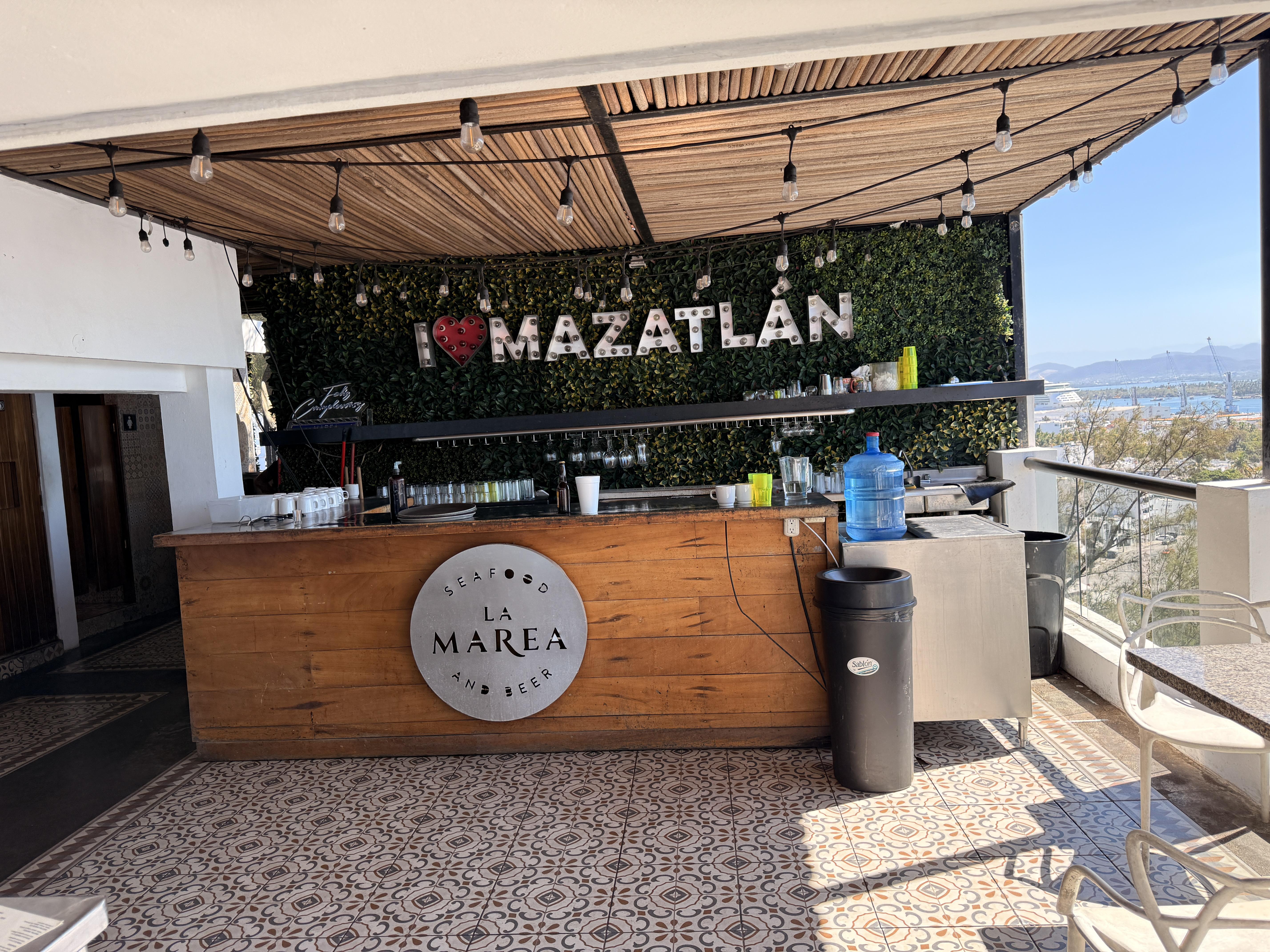 The "I Love Mazatlán" sign on the living green wall behind the bar is an absolute must-photo moment.