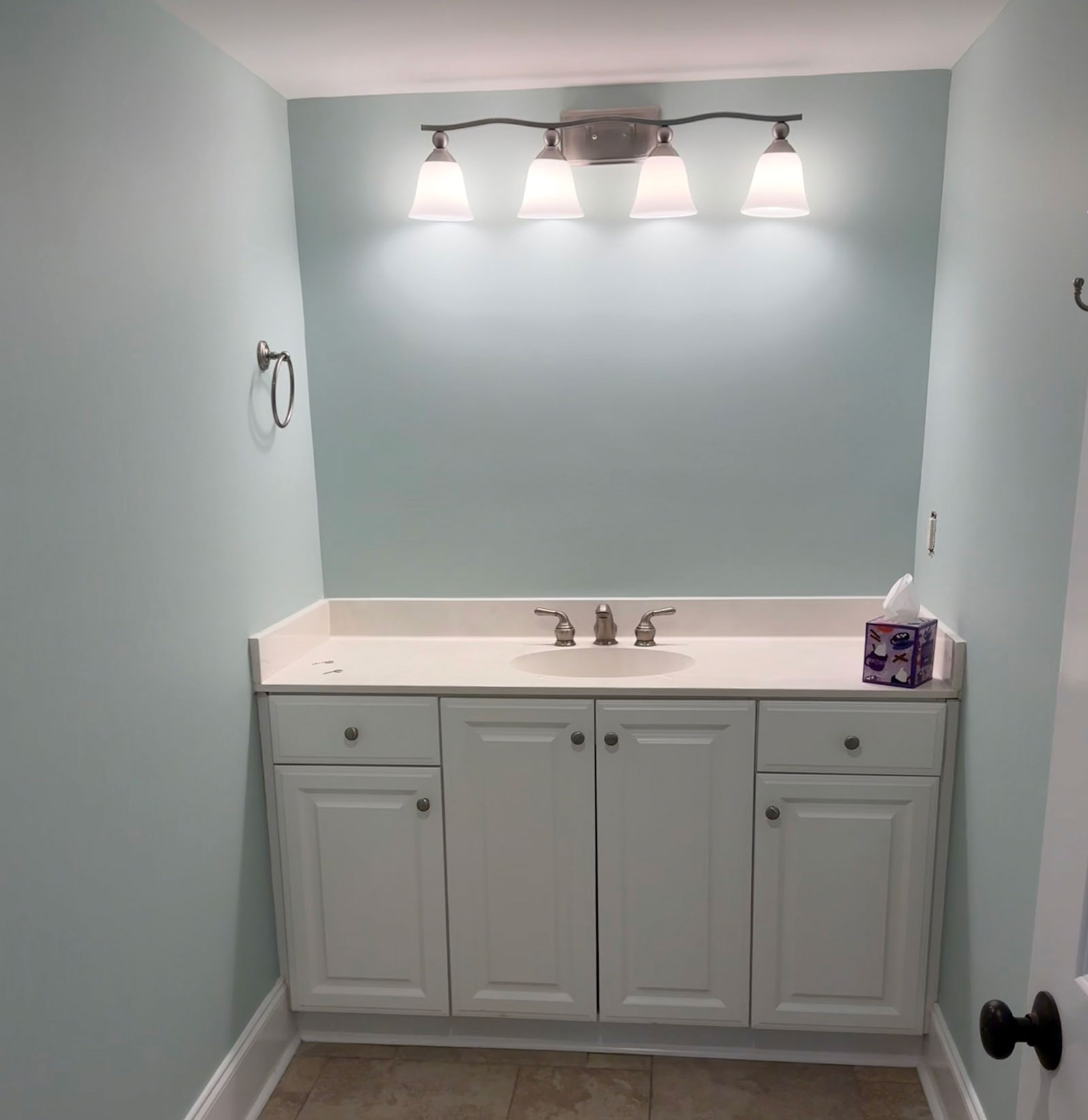 Freshly painted light blue bathroom walls in a residential home by Camellia Painting Company