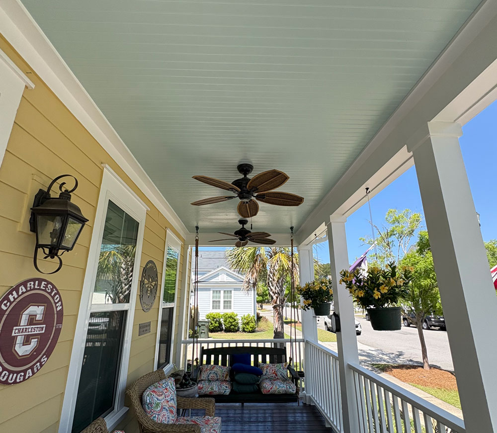 Freshly painted porch ceiling, trim, and columns on a residential home exterior in Summerville SC