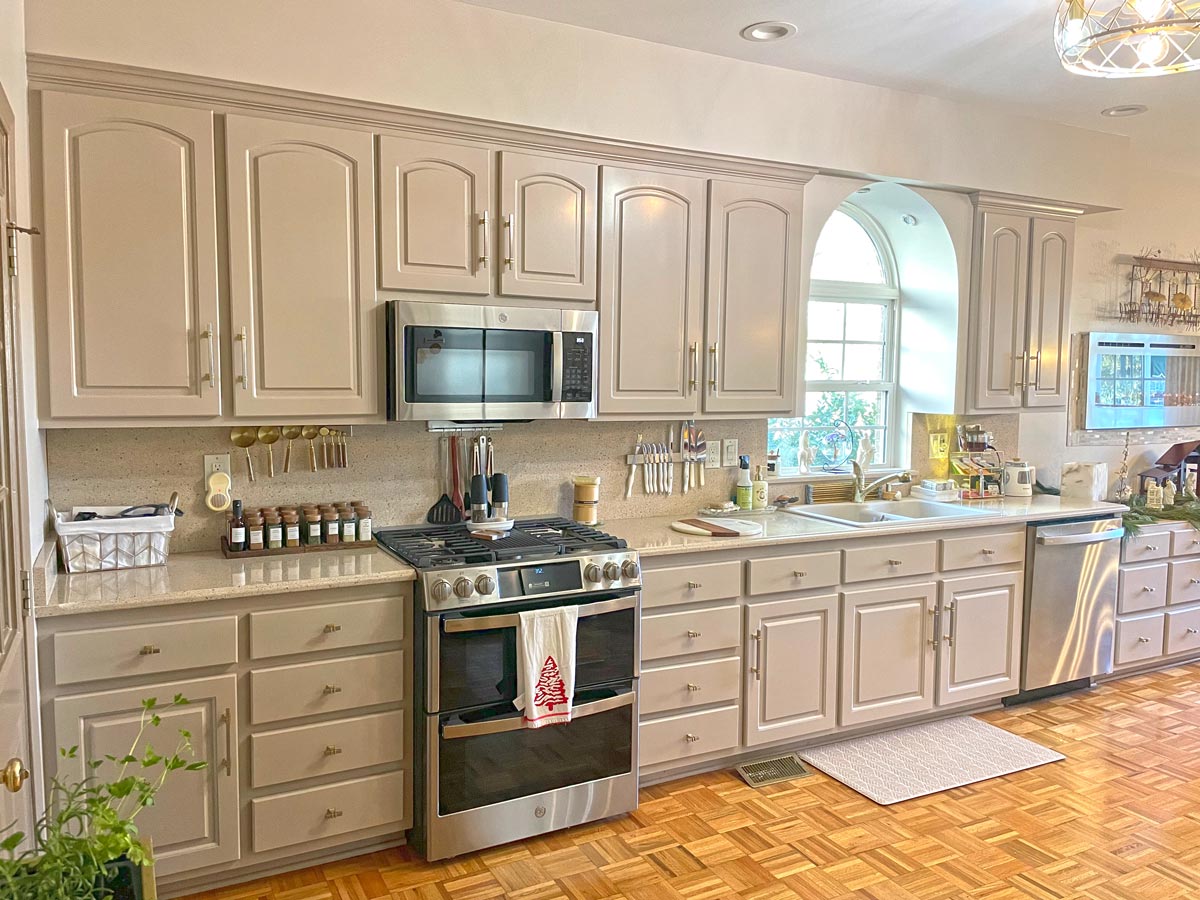 Finished kitchen with professionally painted and refinished cabinets by Camellia Painting Company