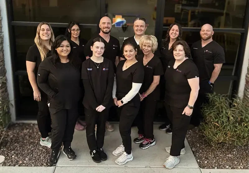 Compass Medical Center Team in front of clinic