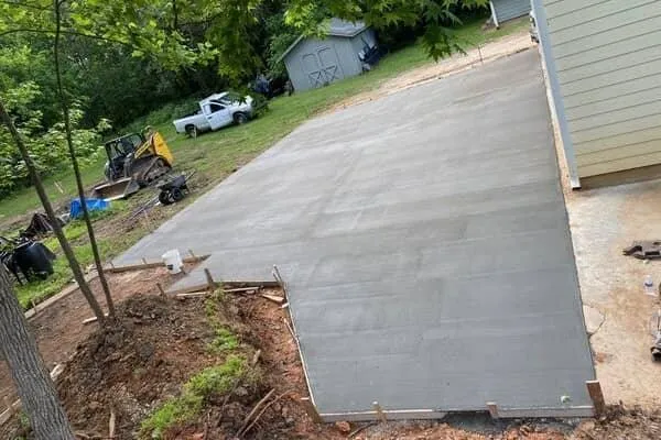 Large concrete patio and driveway extension