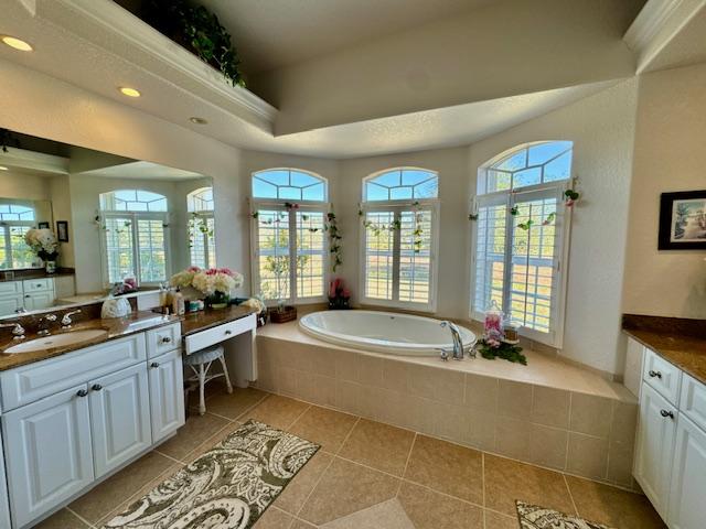 Master bathroom with dual sinks and soaking tub in Punta Gorda home