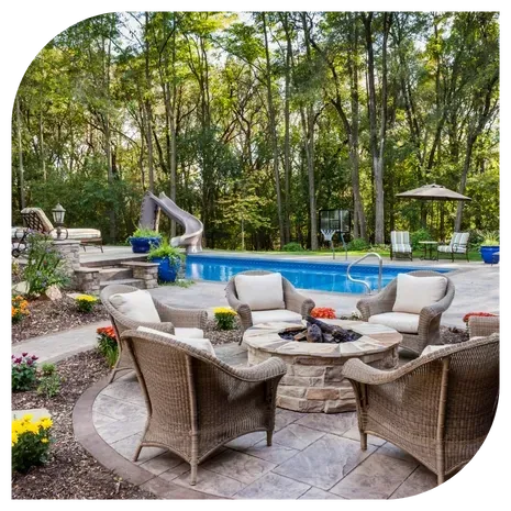Custom-built patio with retaining walls and a fire pit, showcasing quality hardscaping work in Lake Norman.