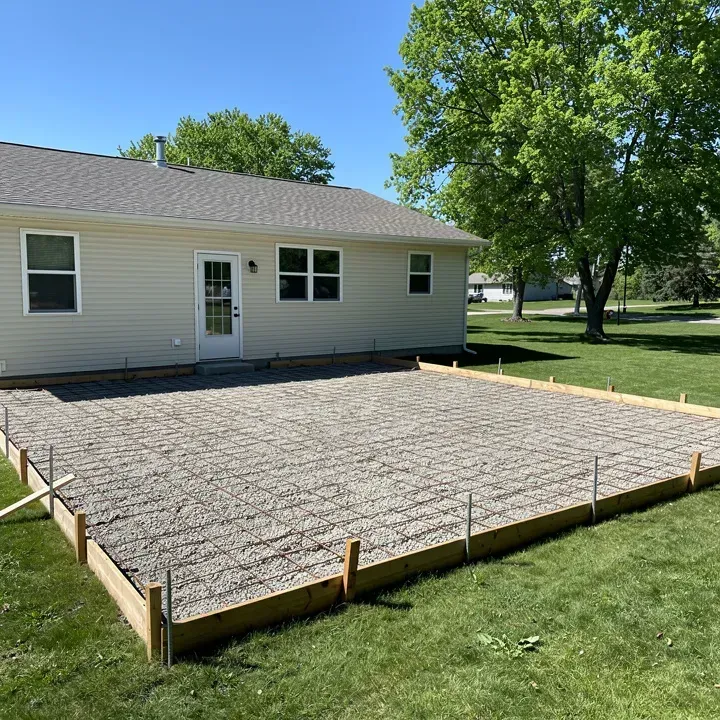 Prepared patio site with forms and base ready for a concrete pour in Baxter, Minnesota