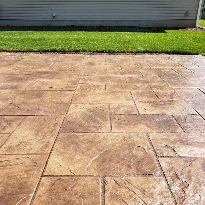 Close-up of a freshly finished stamped concrete surface with a stone pattern in Baxter, Minnesota
