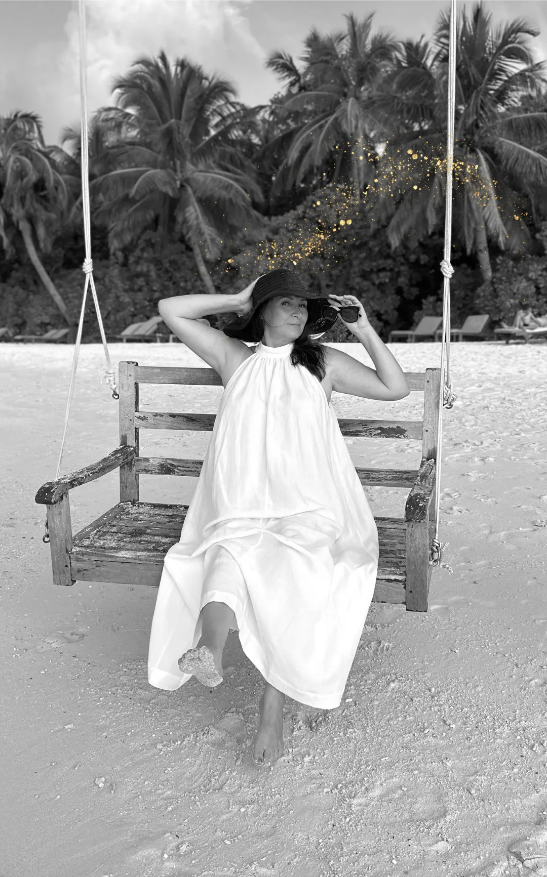 Person journaling with sunlight and crystals, symbolizing conscious manifesting practice