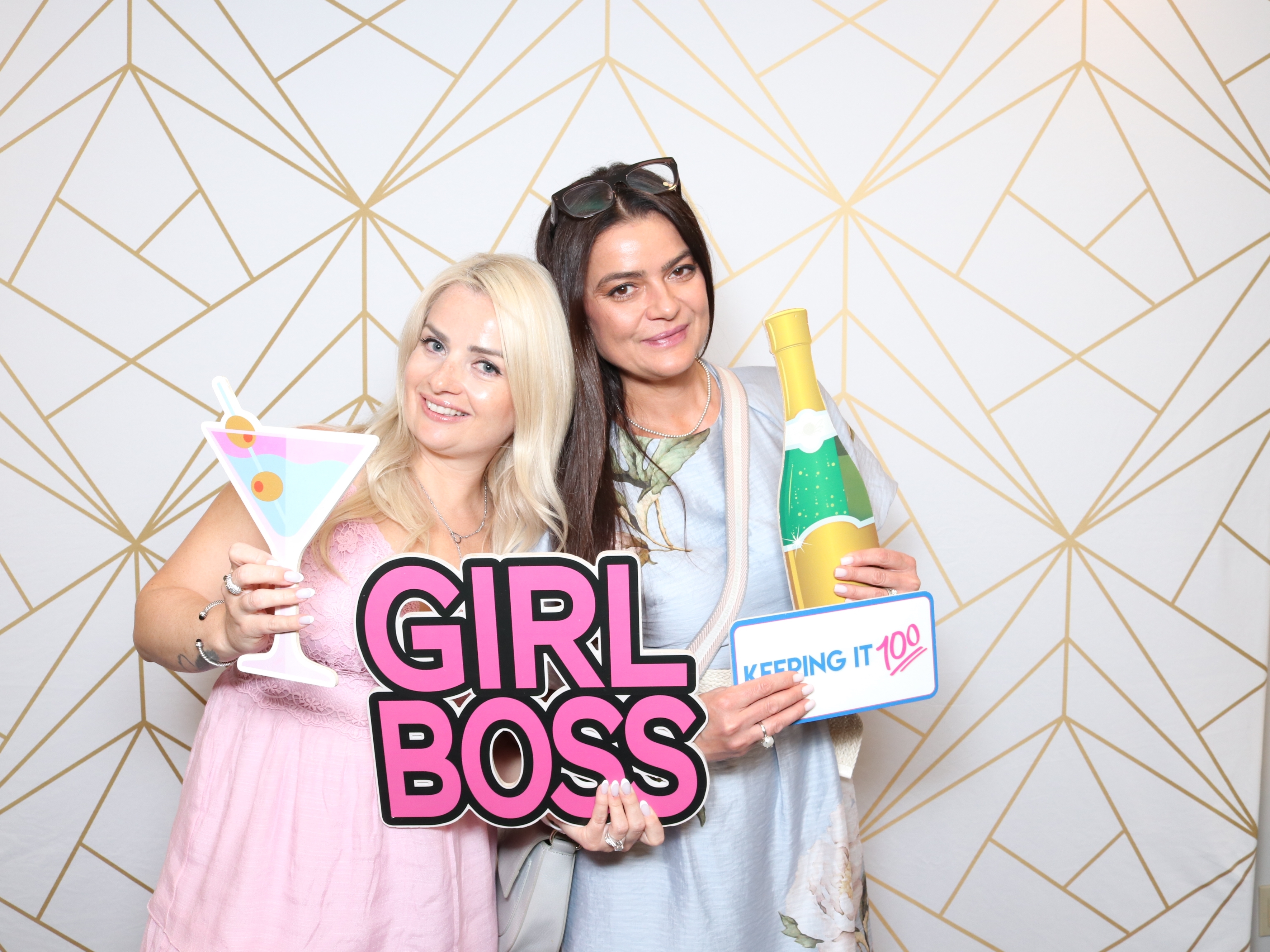 Luxury Photo Booth rental guests enjoying custom props at a Vaughan corporate event