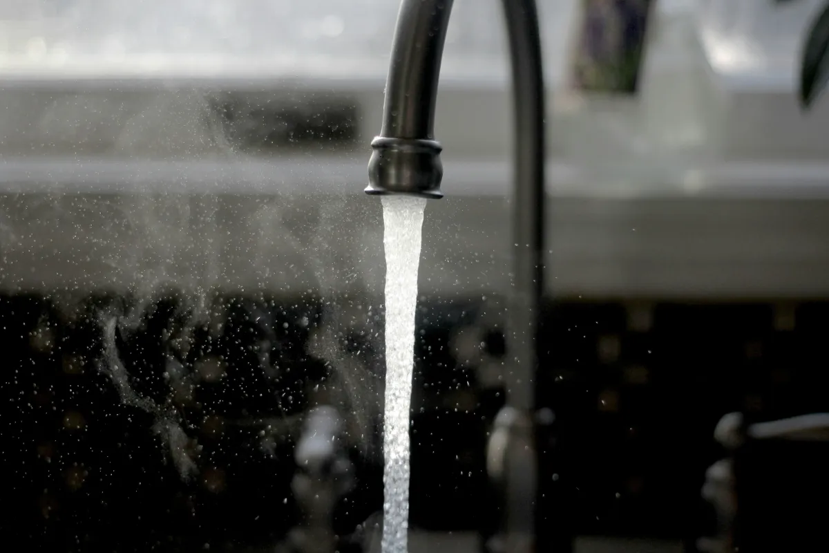 Tap and toilet repair in Tooting with a plumber replacing a kitchen tap