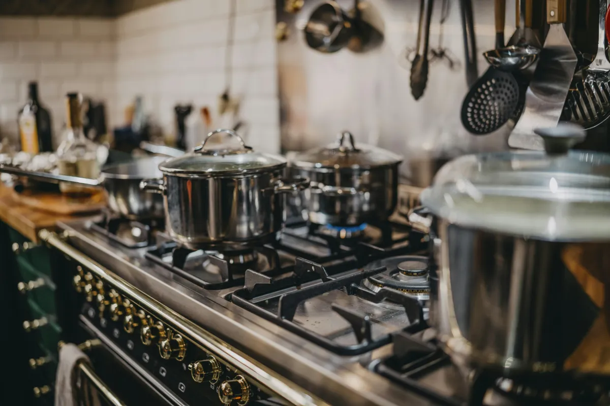 Gas cooker repair and installation in Tooting with an engineer connecting a hob