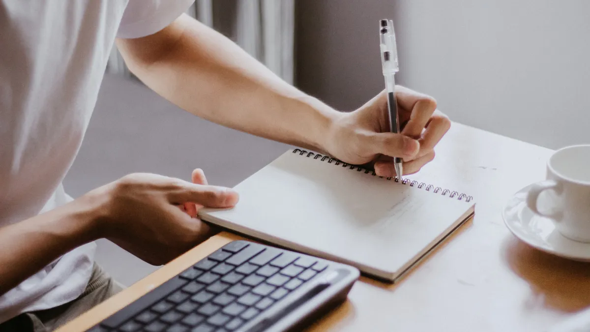 Spanish practice activity worksheet with pen and coffee cup