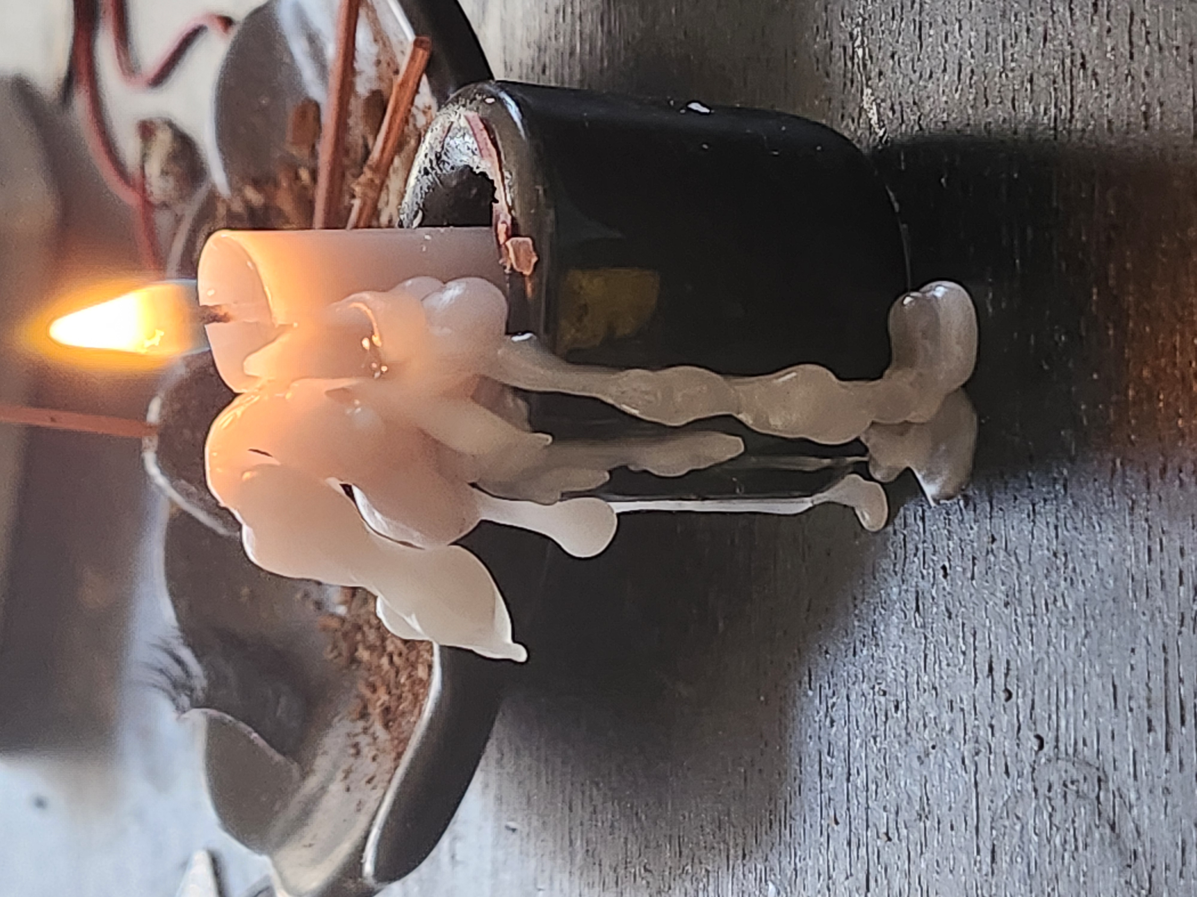 High-contrast New Moon intention setting candle setup with soft glowing lights