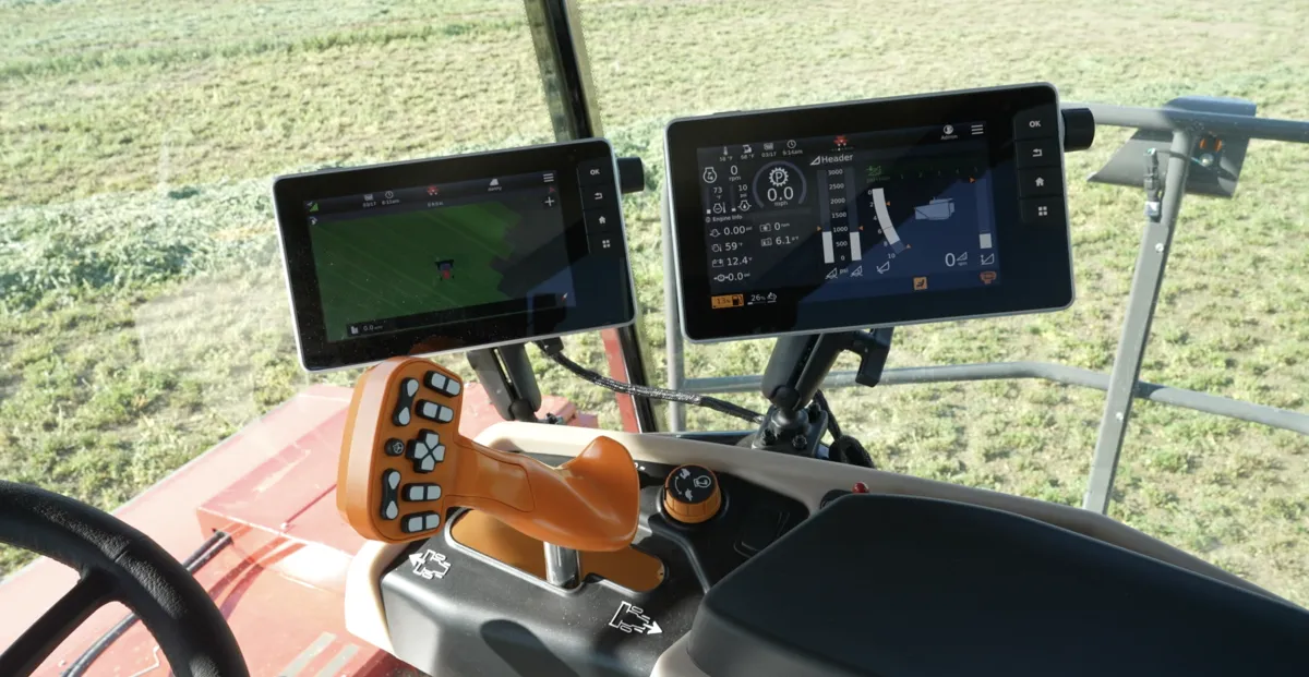 red and black tractor surrounded with tall and green trees