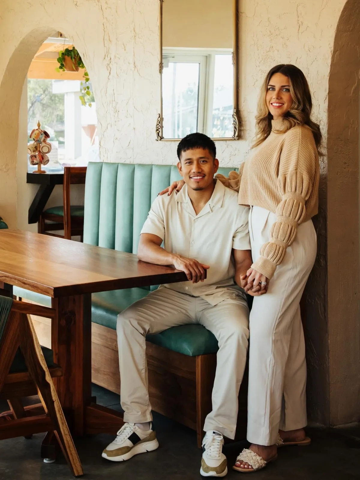 El Cafecito owners Shanie and Cristhian standing side by side.