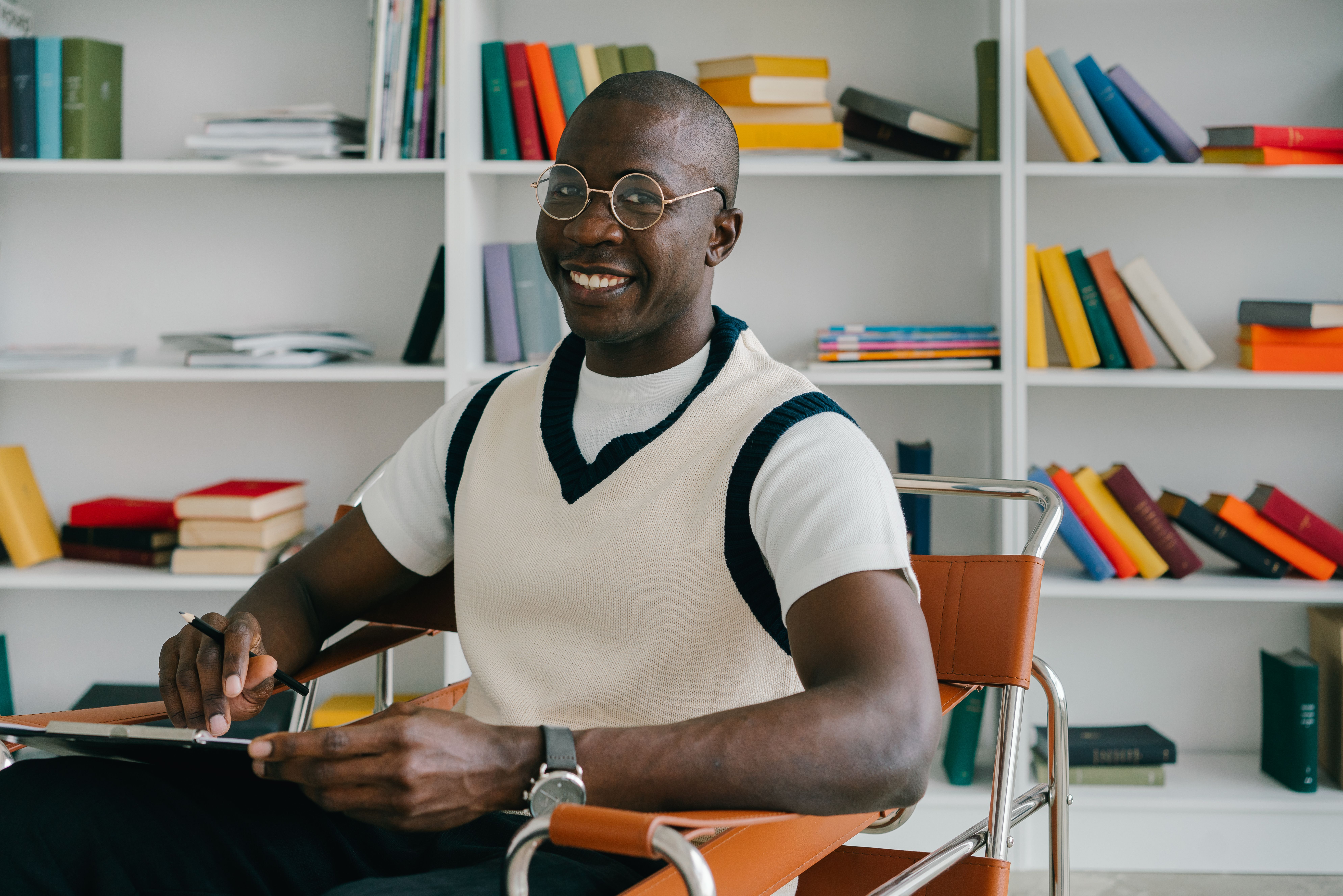 an entrepreneur sitting in a library for personal growth