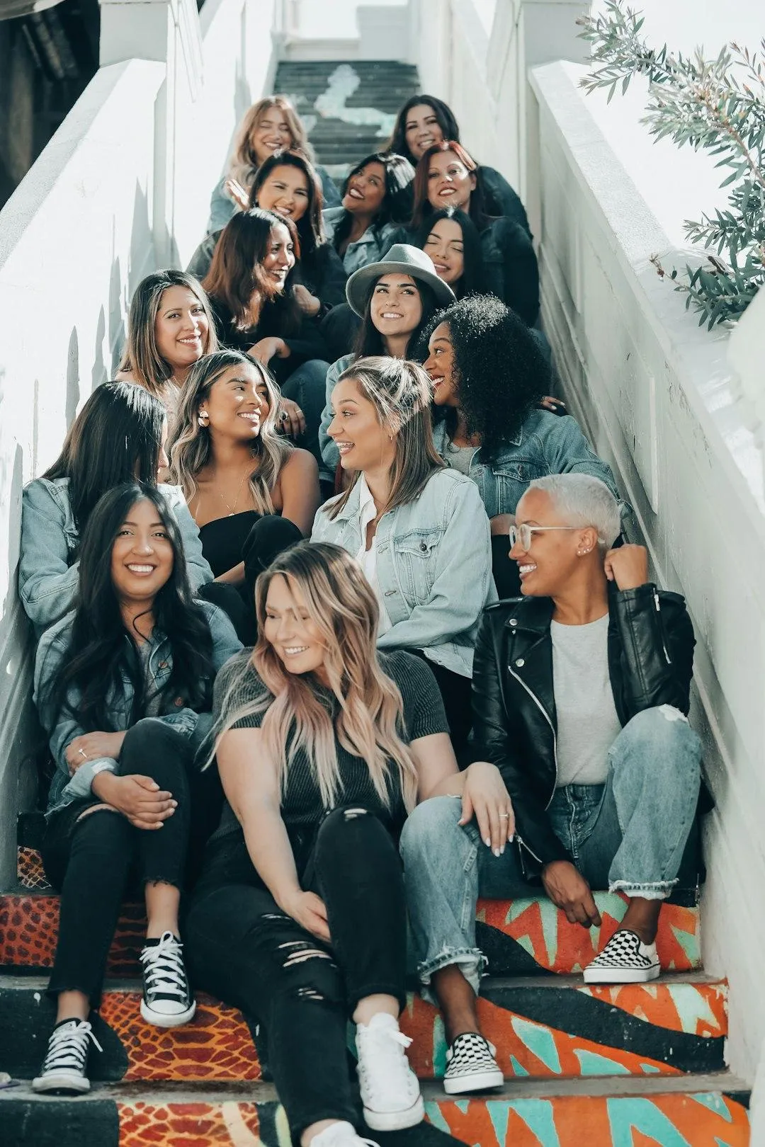 group of women sitting on the stairs
