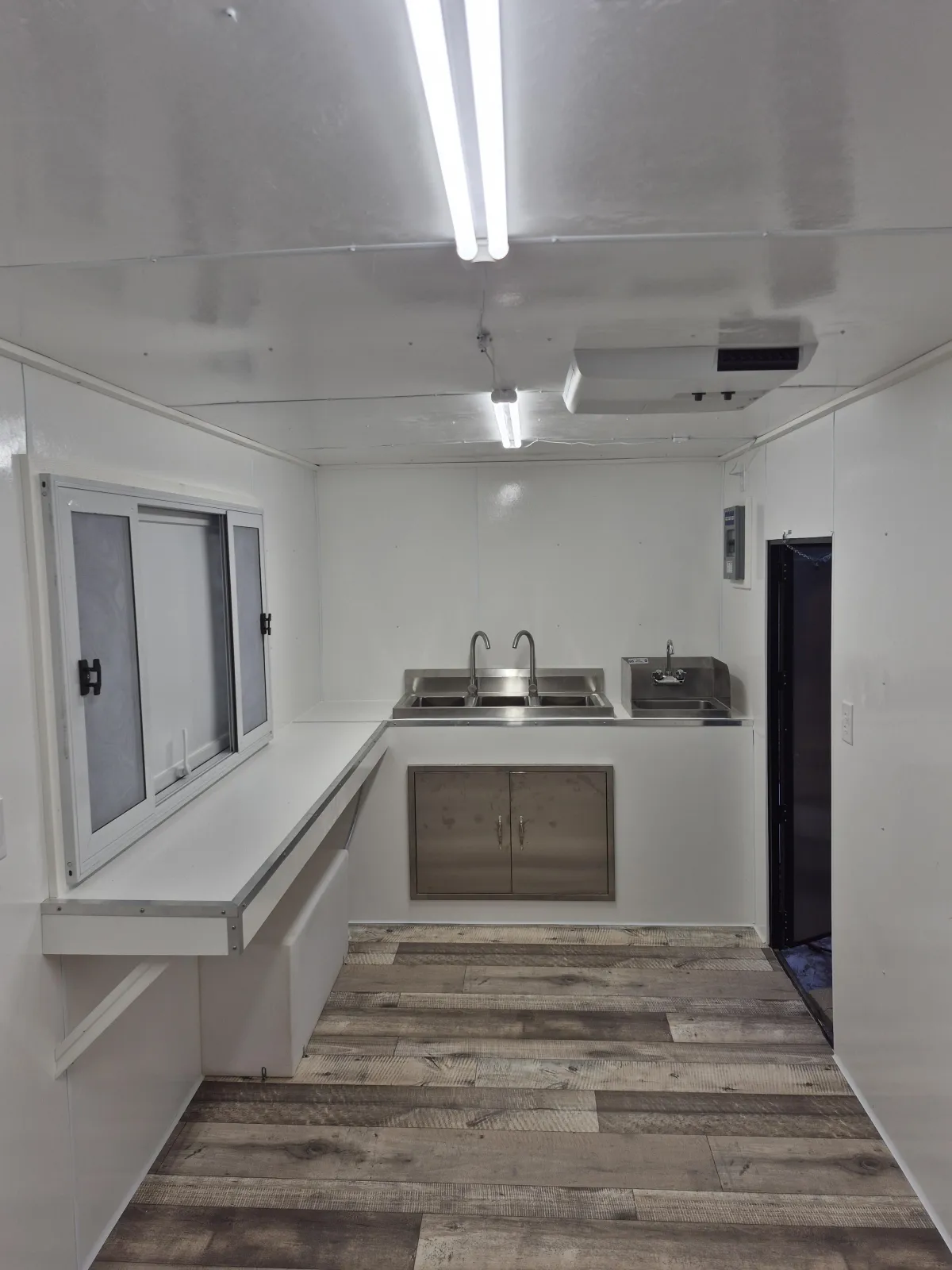A kitchen counter topped with lots of jars and containers