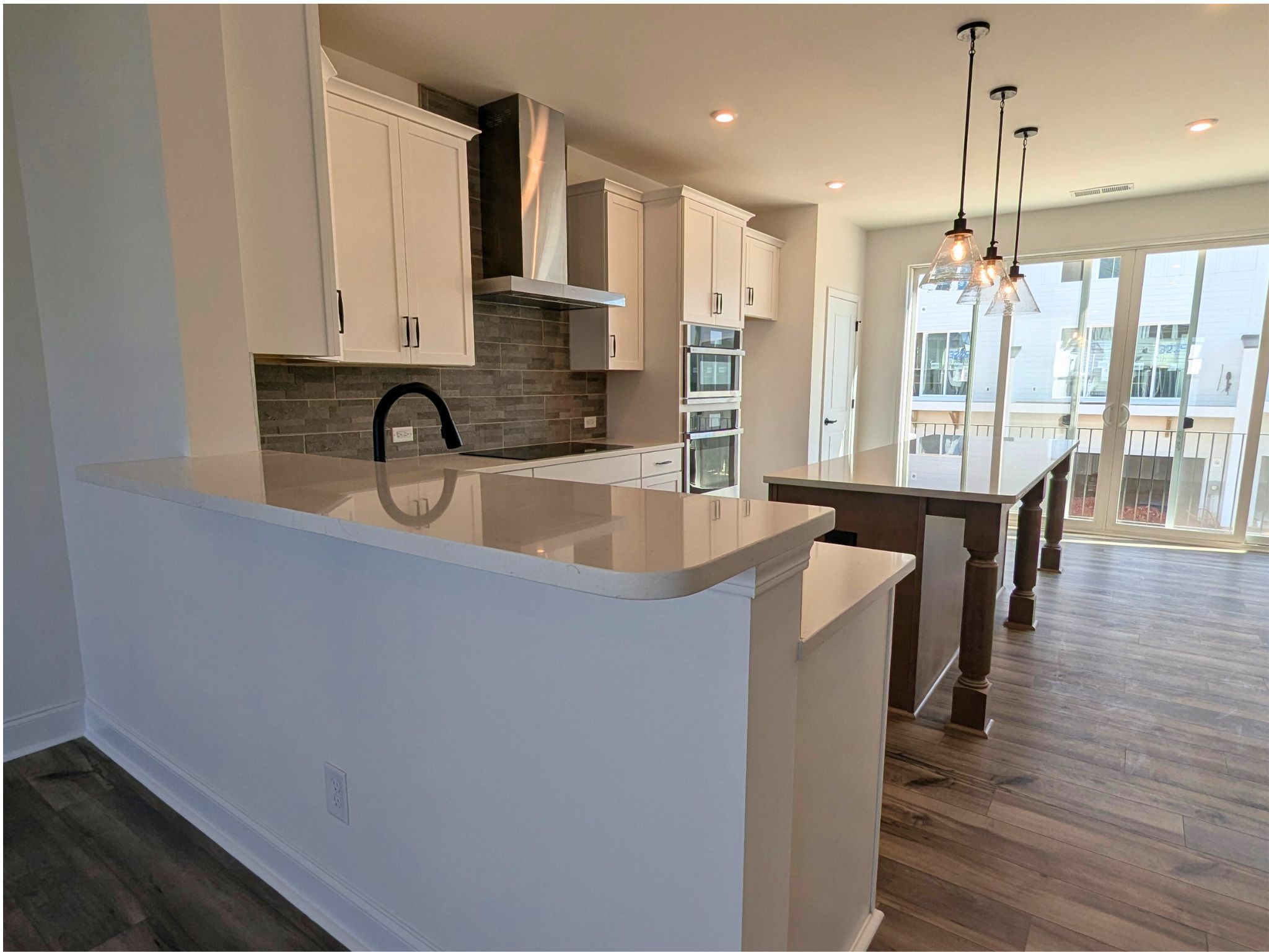 a kitchen with a sink and a stove top oven