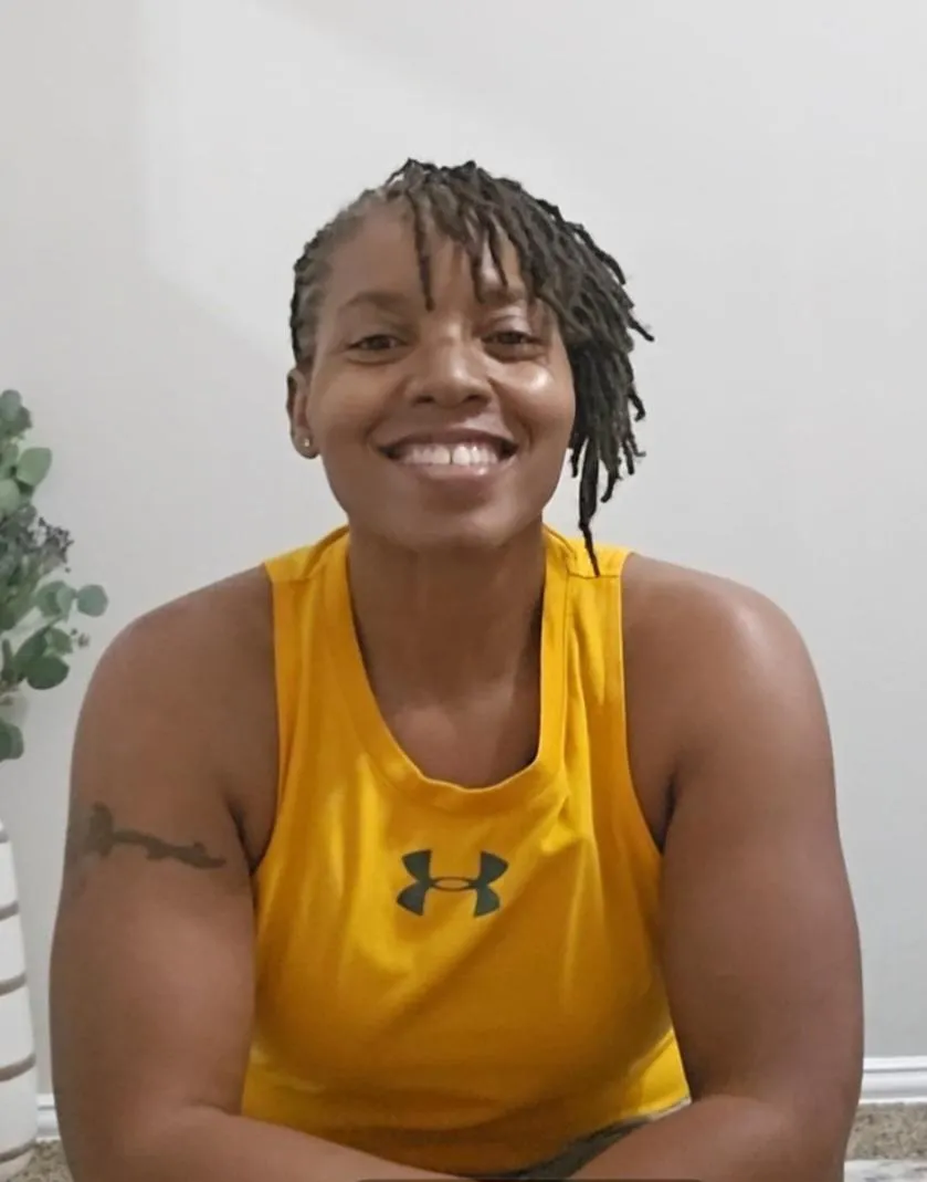 person standing beside black weight