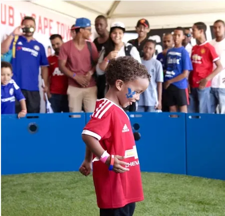 Child playing in the ESA soccer equipment at a party