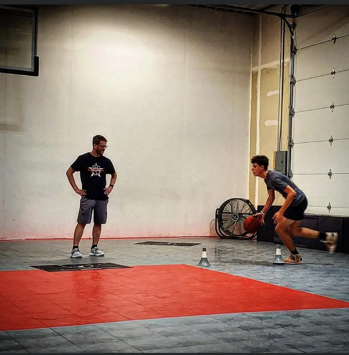 Coach demonstrating skills on video