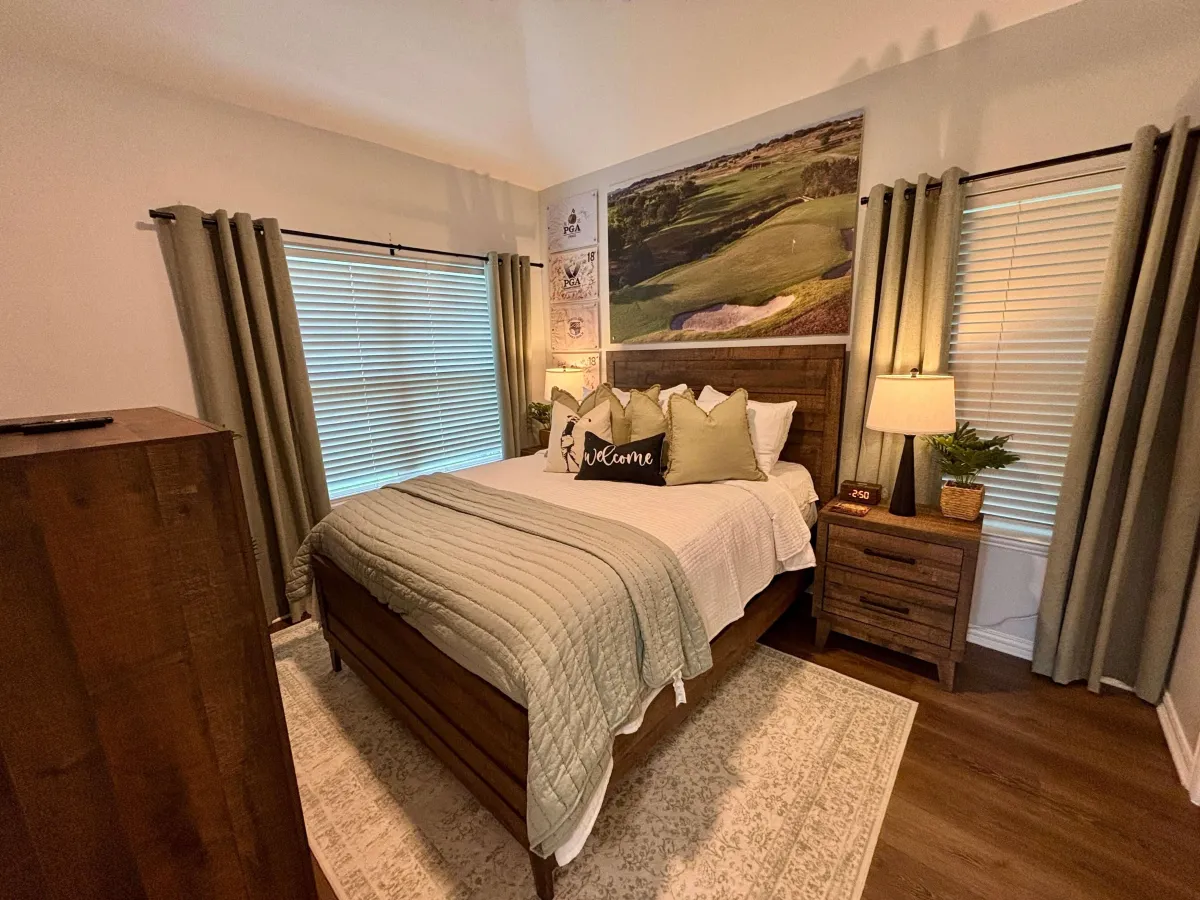 Rustic bedroom with bunk beds, wood ceiling, modern accents, and serene vibes.
