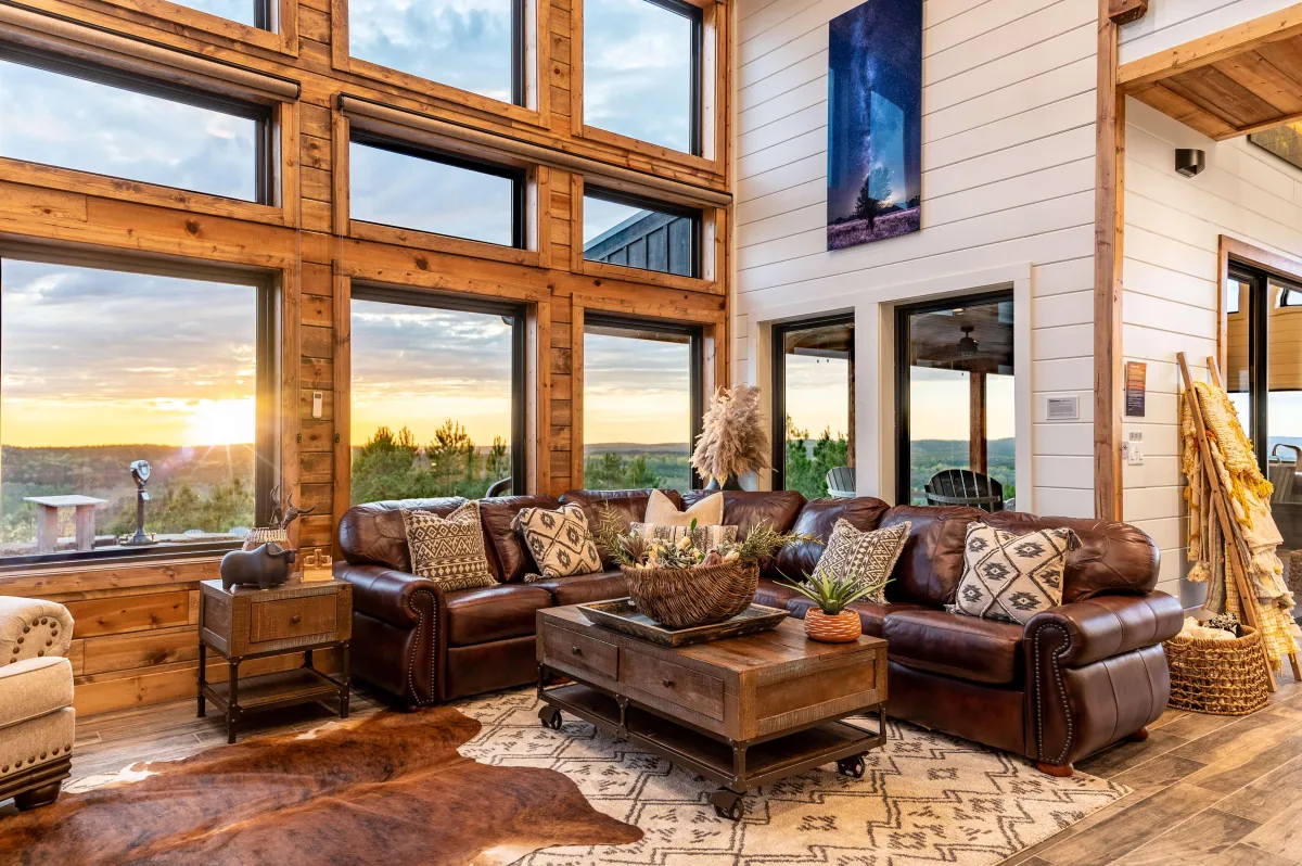 Charming loft bedroom with wooden ceilings, cozy beds, and rustic decor.