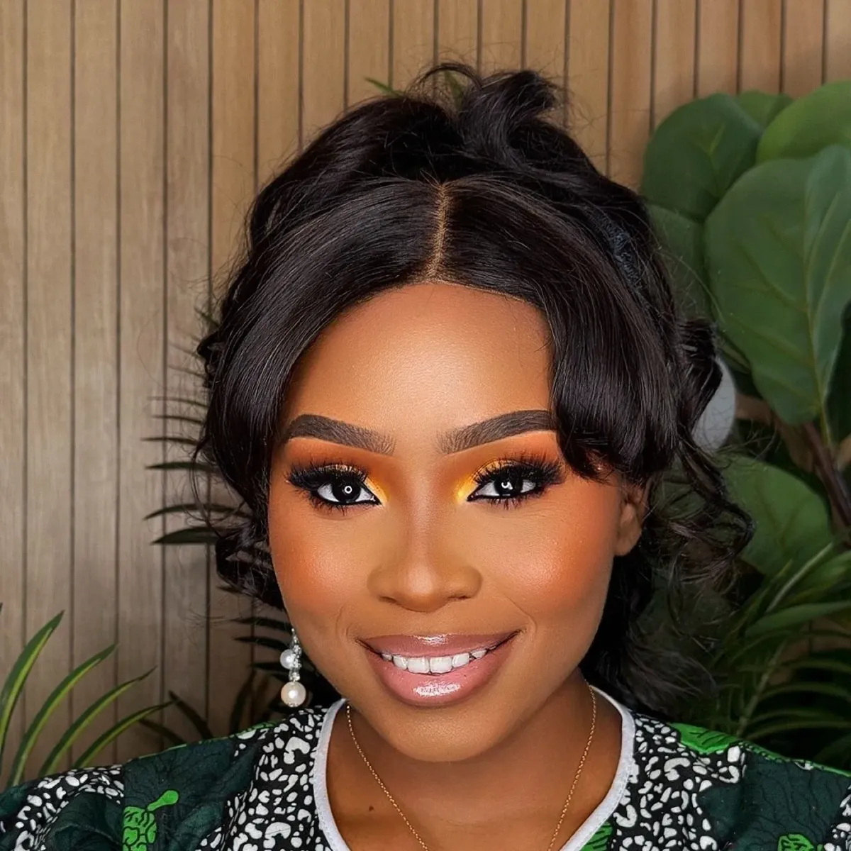 Beautiful frontal installation with sophisticated updo styling by JB's Dazzle makeup and beauty services in Hyattsville, MD.