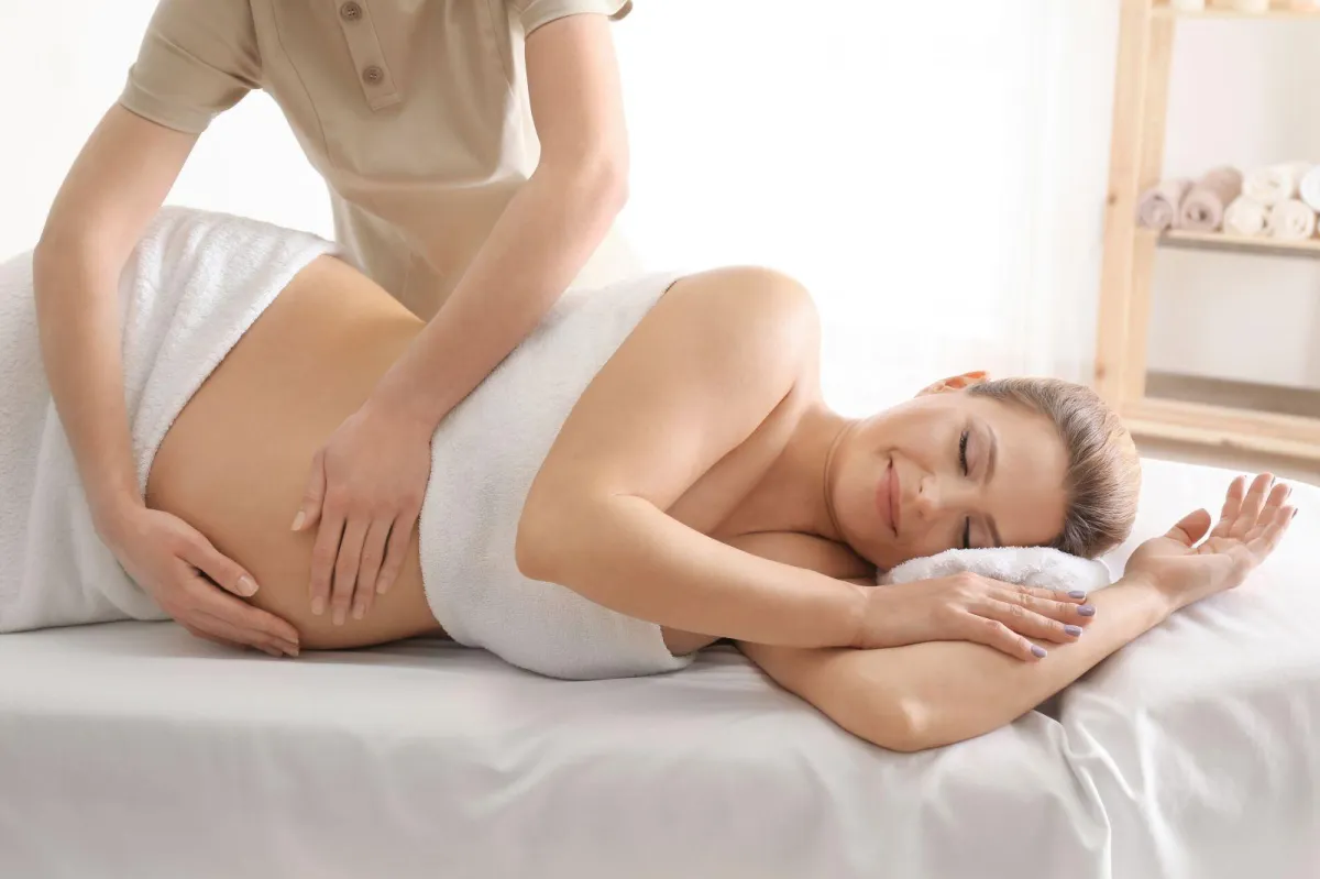 A soon to be mother recieving a prenatal massage.